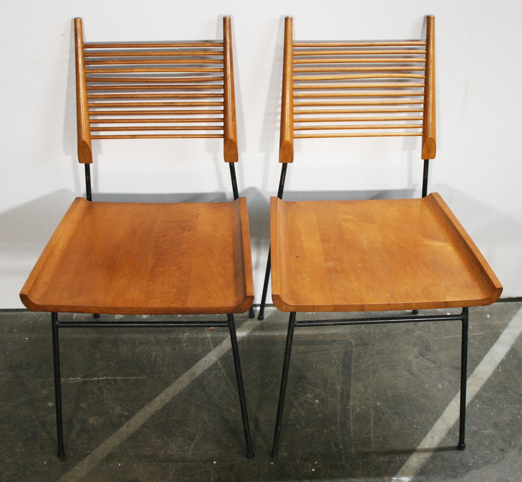 Pair of original rare midcentury Maple Paul McCobb planner group #1533 shovel side dining chairs. Solid maple seat and spindle back on Iron base. Original vintage condition. Original medium brown Tobacco finish. These chairs are marked Paul McCobb