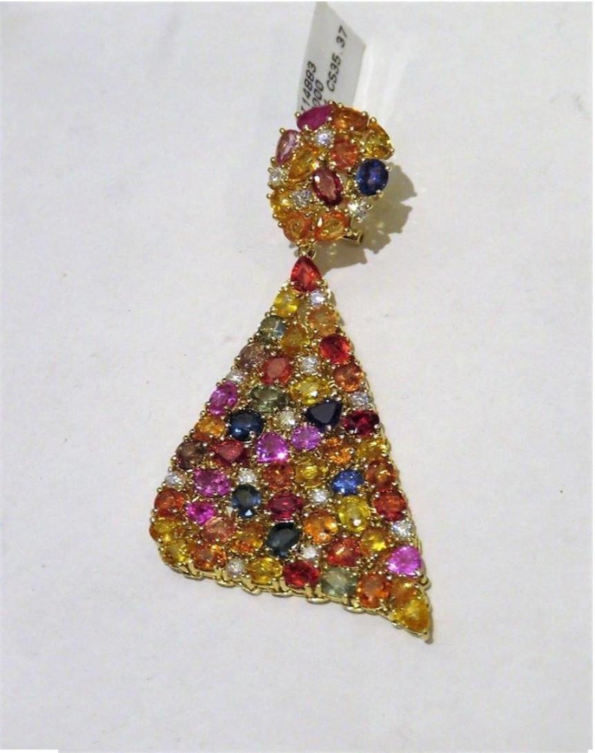 The Following Items we are offering is a Rare Important Pair of 18KT Yellow Gold Multi Sapphire and Diamond Dangle Earrings, containing mixed cut Rainbow Sapphires and Diamonds measuring approximately 8.88 x 6.7
Stamp: 18KT T.C.W. Approximately