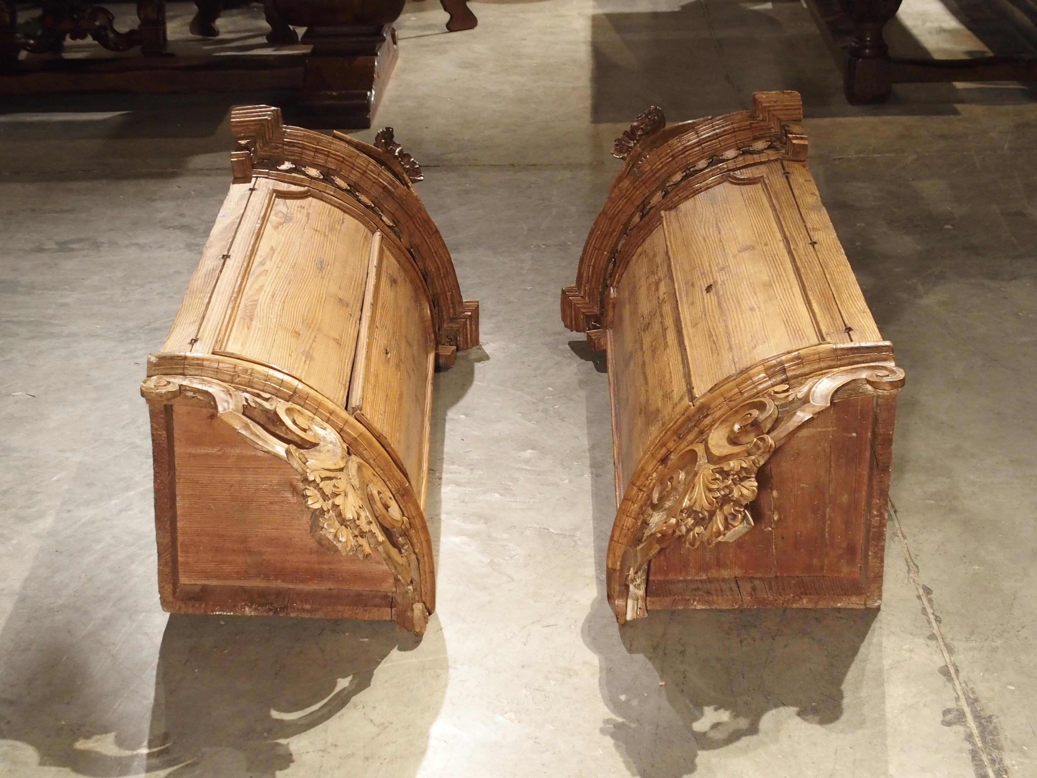 This is an extremely unusual pair of hanging cabinets constructed of natural pine, which date to circa 1740. These would have been commissioned for an important villa, each hanging high in an opposing corner. The old locks would have secured