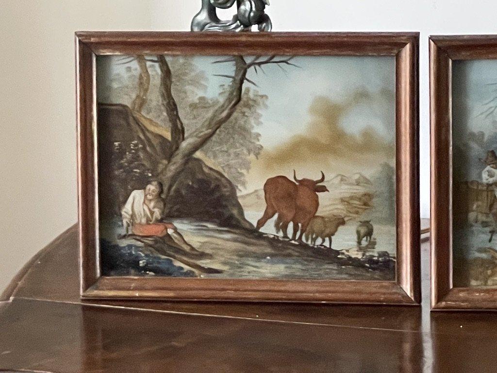 Pair of very rare 18th Century reverse glass or verre eglomise paintings of country scenes, found in Provence The paintings are behind an extra panel of glass for protection.