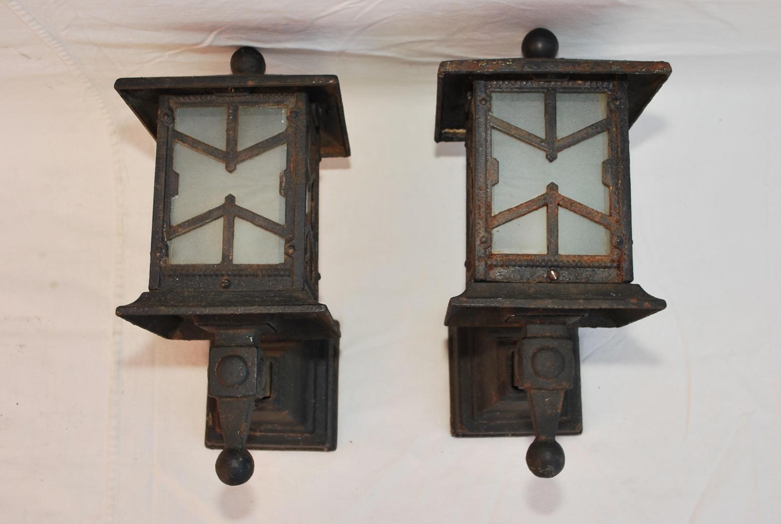 A rare pair of outdoor 1920s cast iron sconces, they are quit heavy, they are all original now, but we could restored them.

 
