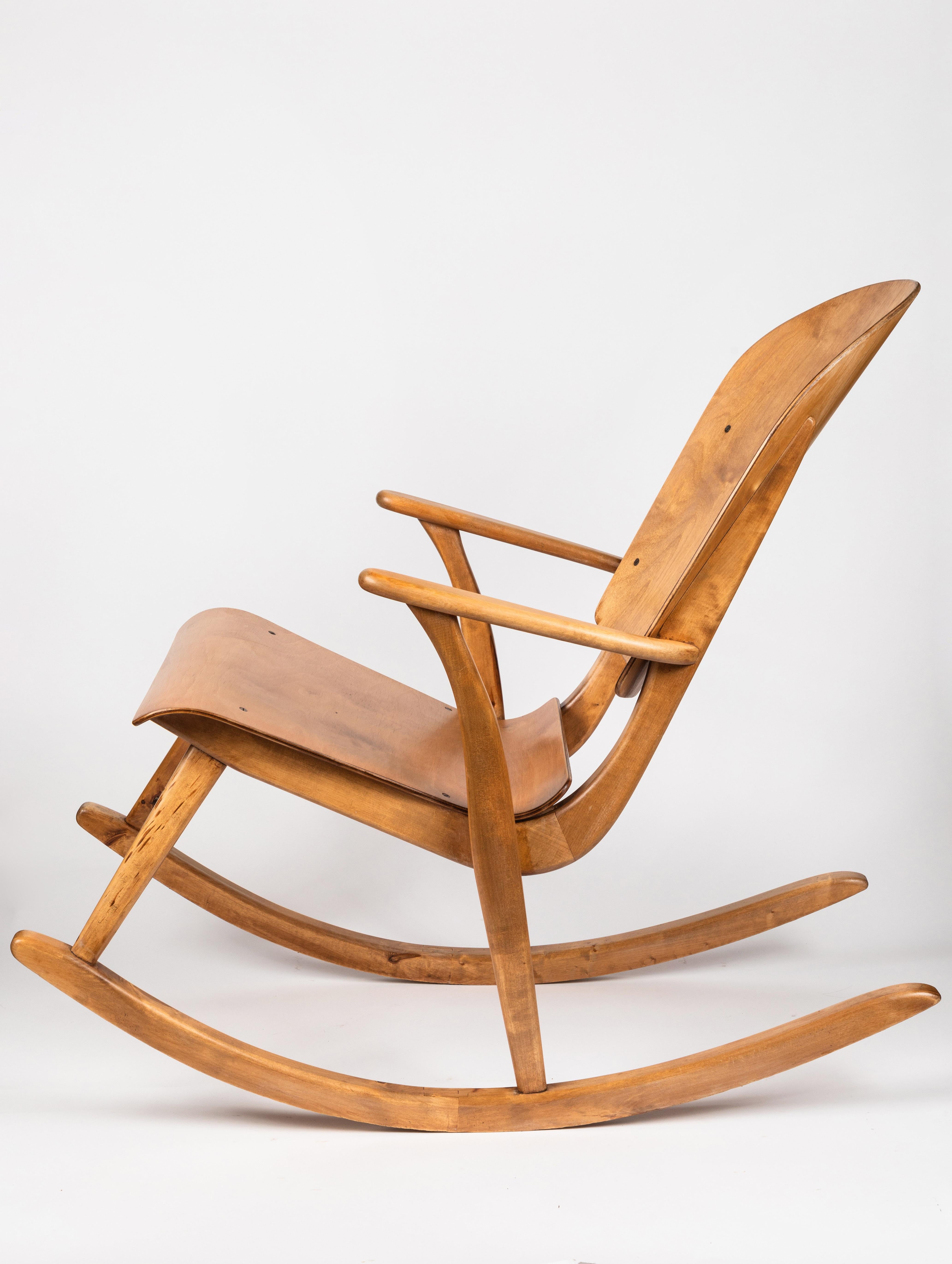 Rare Pair of 1940s Rocking Chairs by Ilmari Tapiovaara. These extremely rare and beautiful chairs were fabricated in European birch by Keravan Puuteollisuus Oy, Finland, circa the late 1940s. This incredibly refined design is quintessentially