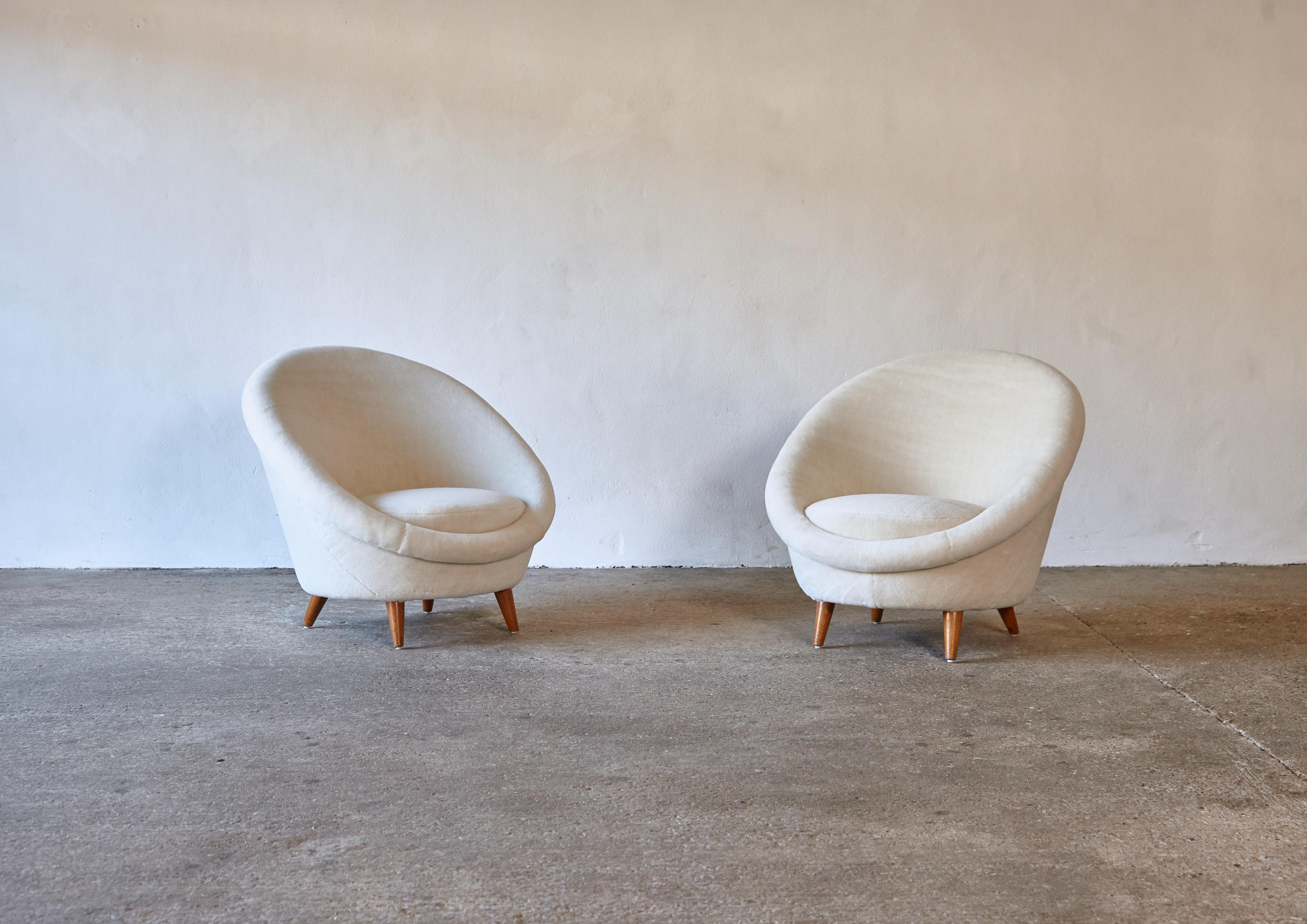 A beautiful pair of 1950s Norwegian egg lounge chairs, newly upholstered in luxury cream Alpaca velvet. Priced and sold as a pair together. Fast shipping worldwide.




UK customers please note:    displayed prices do not include VAT.


