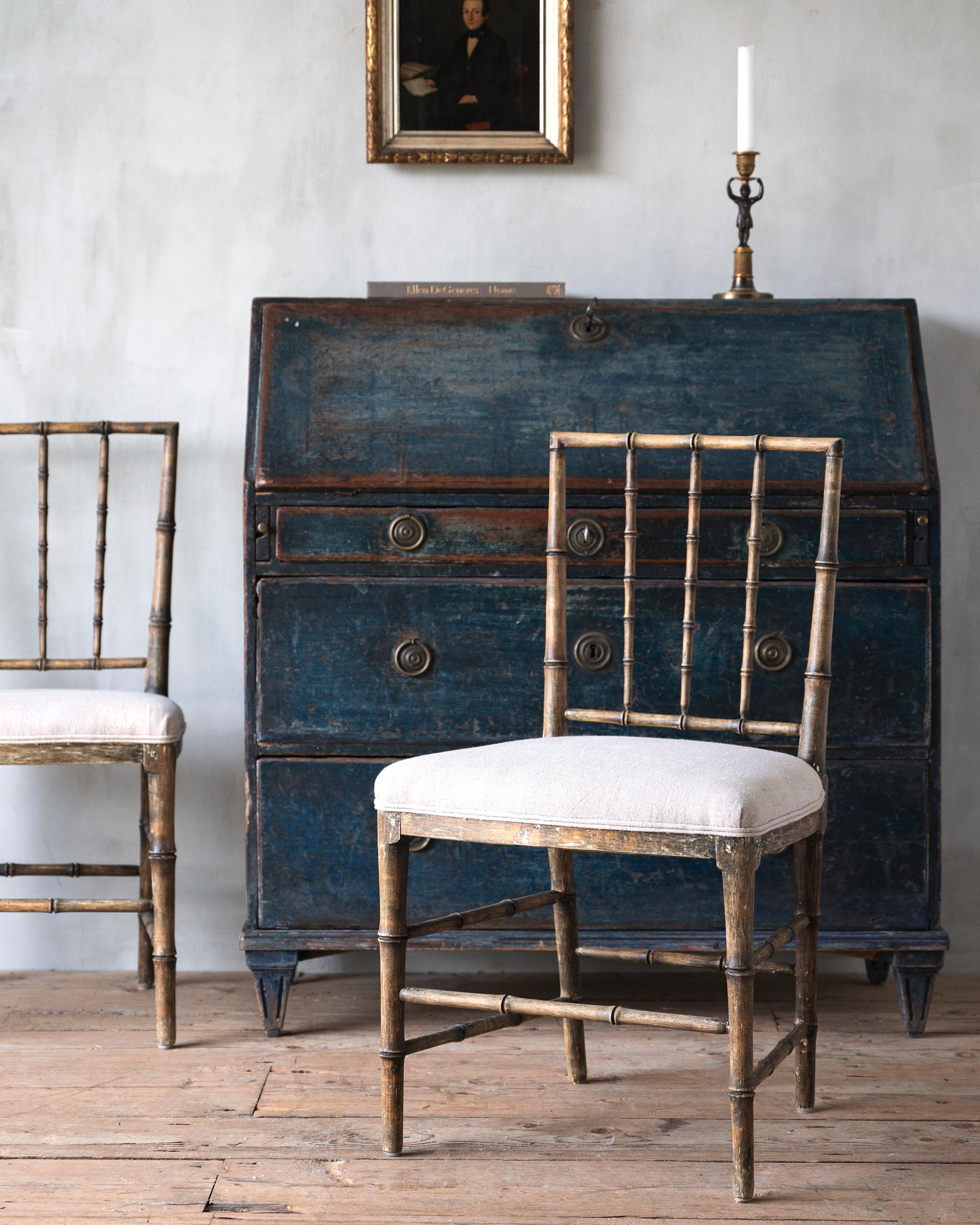 Rare pair of early 19th century Gustavian faux bamboo chairs in their original finish. Ca 1810 Stockholm, Sweden. 

The chairs are attributed to Ephraim Sthal. Supplier to the Royal Court and one of the most sophisticated and inventive makers of his
