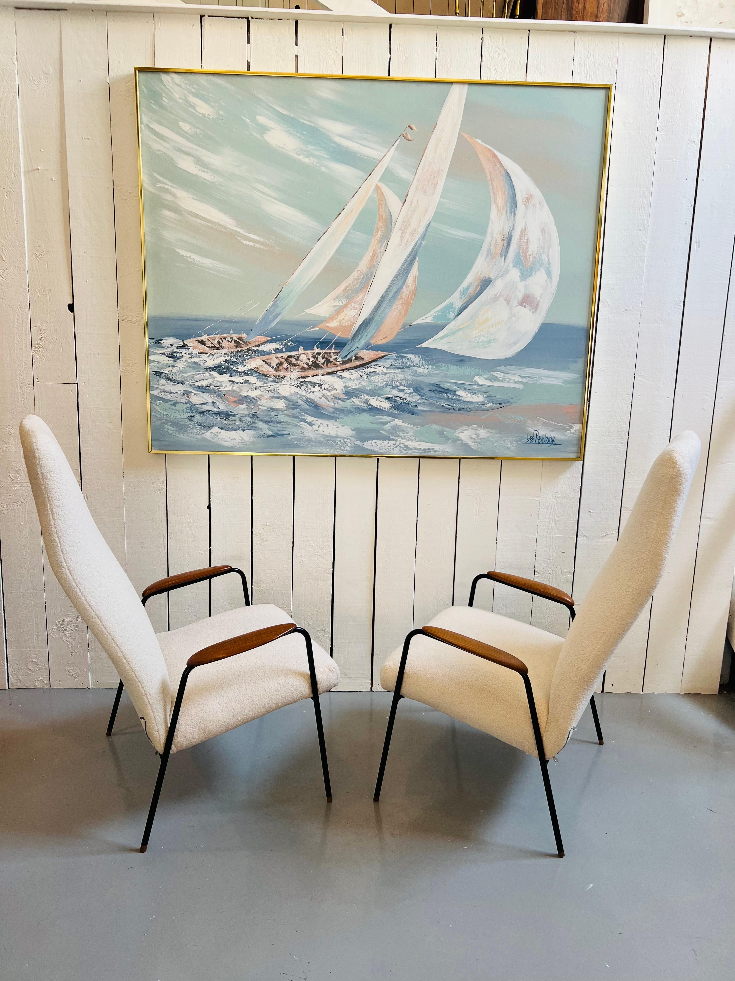 A Stunning pair of chairs rarely available.
Stunning simple design with metal frame terminating on small wooden wooden inserts.