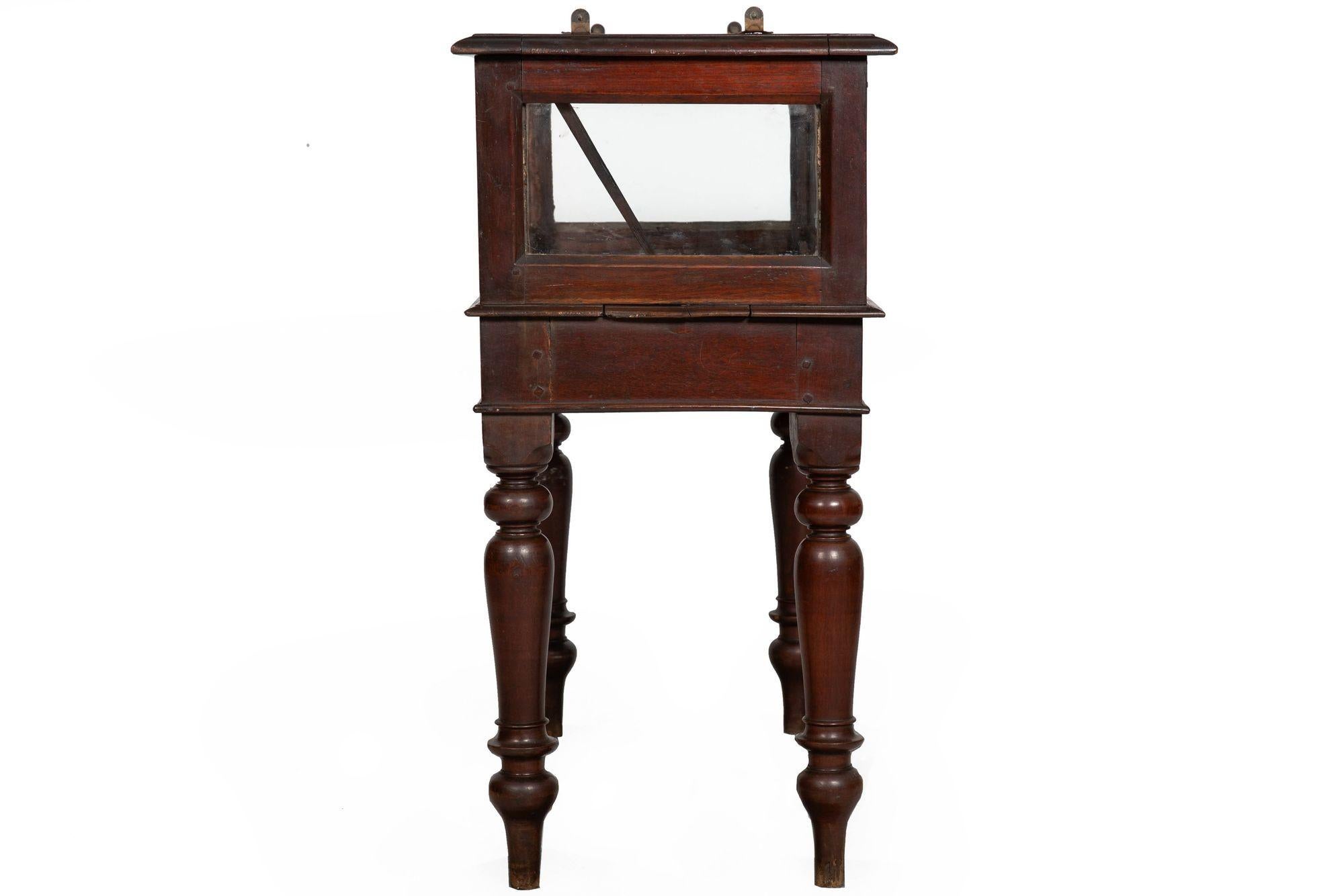 A SCARCE PAIR OF ANGLO-INDIAN TEAK VITRINE CABINETS

Probably British Colonial, circa mid-19th century

35 1/4