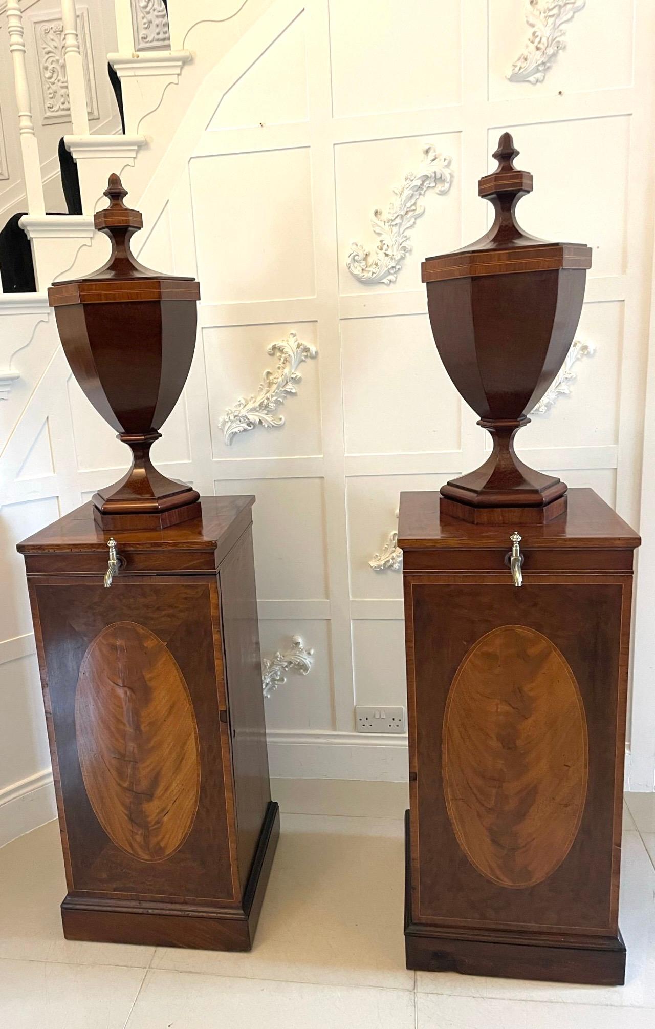 Rare pair of antique George III outstanding quality mahogany inlaid wine urns on original pedestal cupboards having a lift off shaped lidded top revealing the original lead lining, hexagonal shaped urn with satinwood inlay above a freestanding