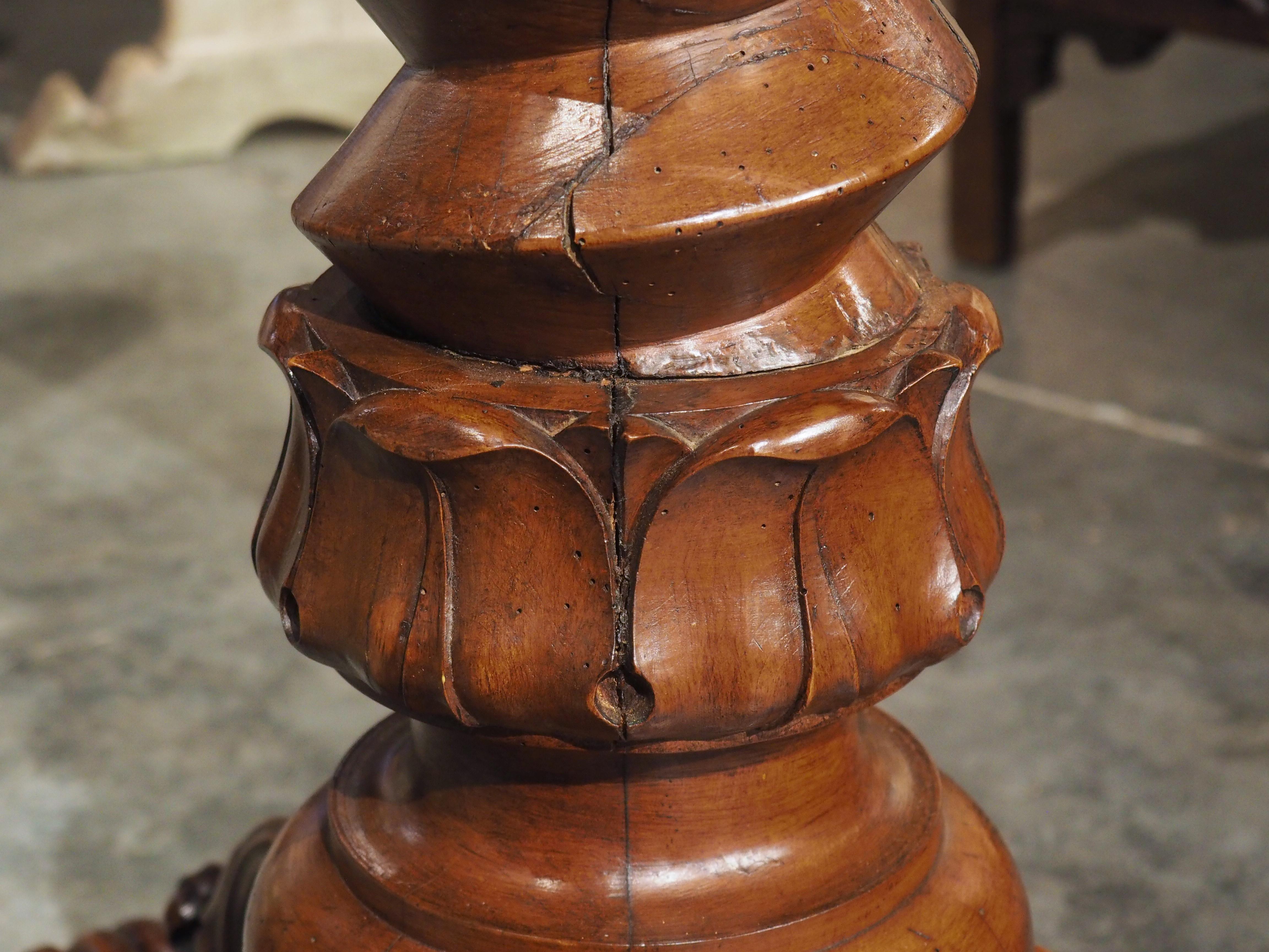 Hand-carved in France, circa 1850, these fascinating wine press screws have been repurposed to form the columns of this rare pair of sellettes, or tall pedestals. Originally used at a French vineyard to extract juice from grapes by applying