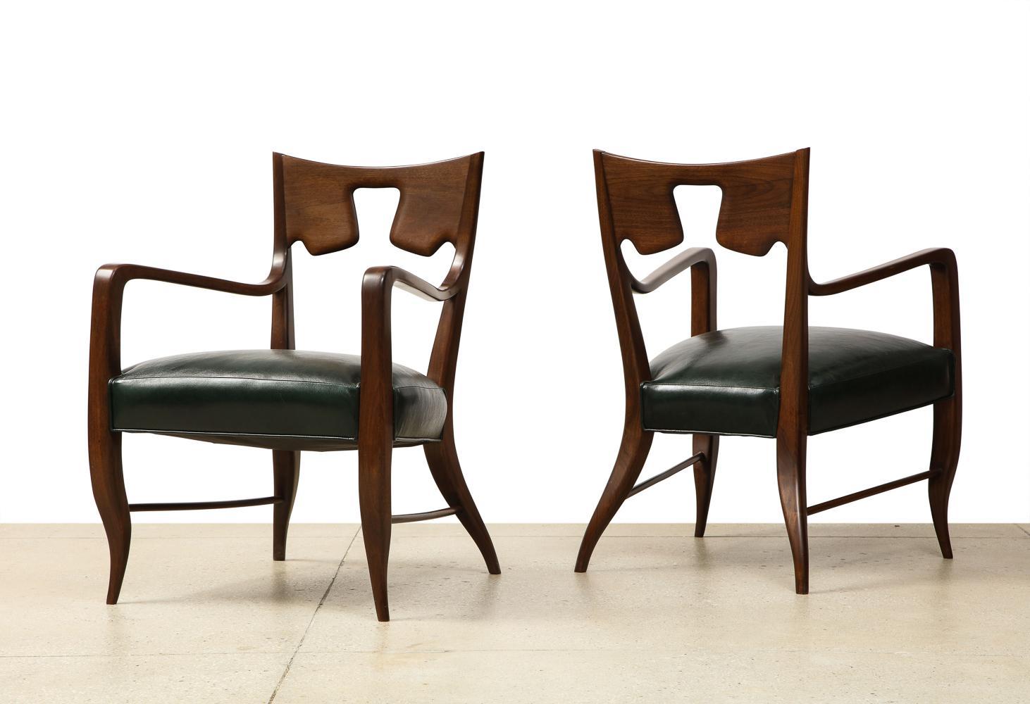 Dark-stained walnut frames & leather seats. Produced by Giordano Chiesa. Wood has recently been refinished and seats have been re-upholstered. These chairs have been authenticated by the Gio Ponti Archives.