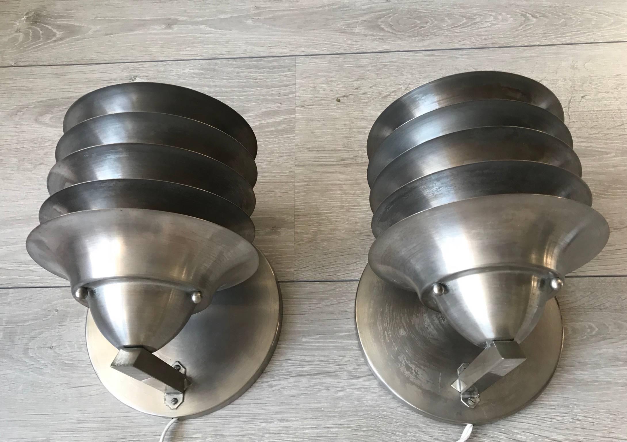 Practical size, wonderfully slats designed and beautiful condition sconces.

If rare and highly attractive light fixtures is what you are looking for then these early 20th century sconces could take the space you have in mind for them to the next