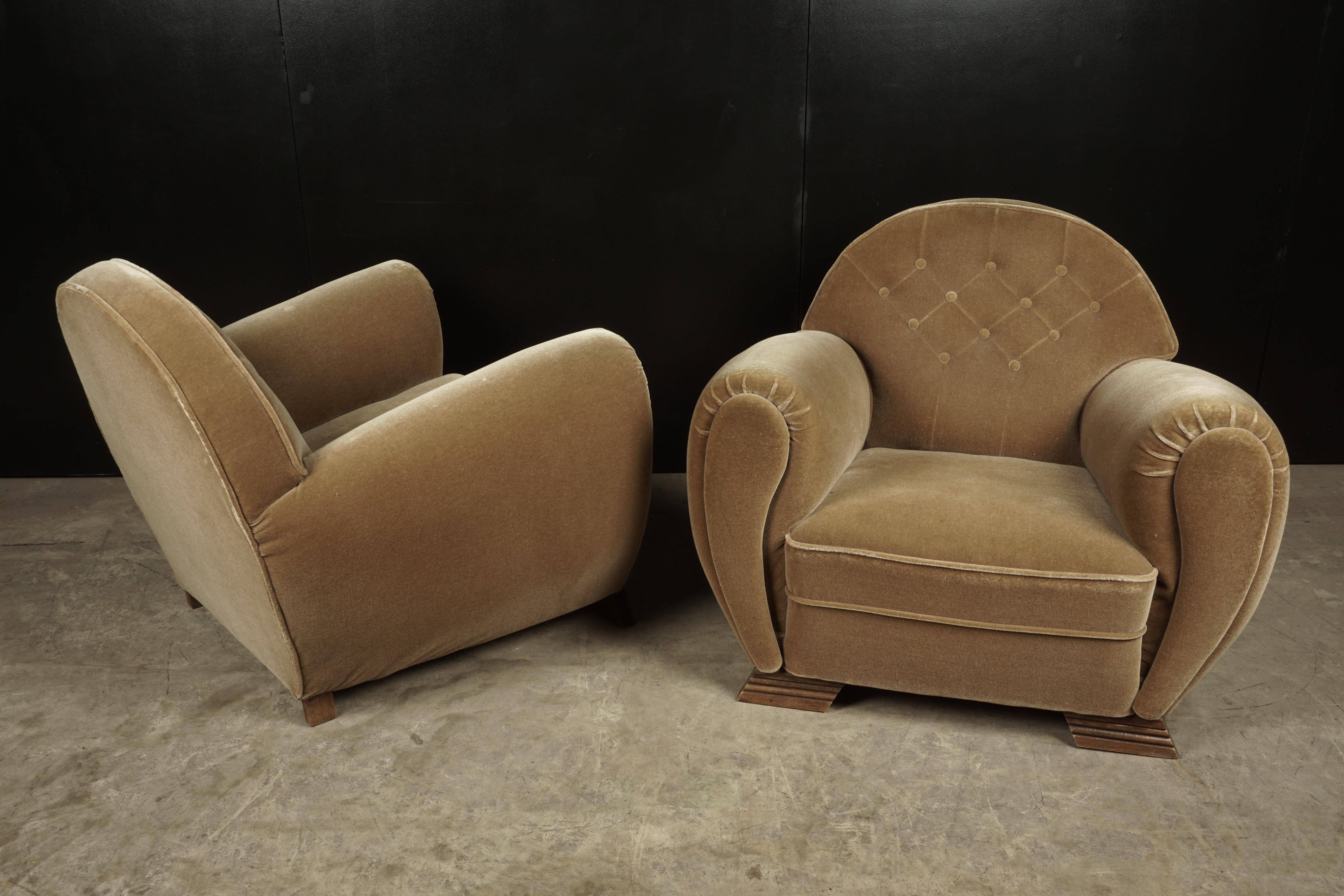 Rare pair of Art Deco lounge chairs from France, circa 1950. Original blush velour upholstery. Superb design.