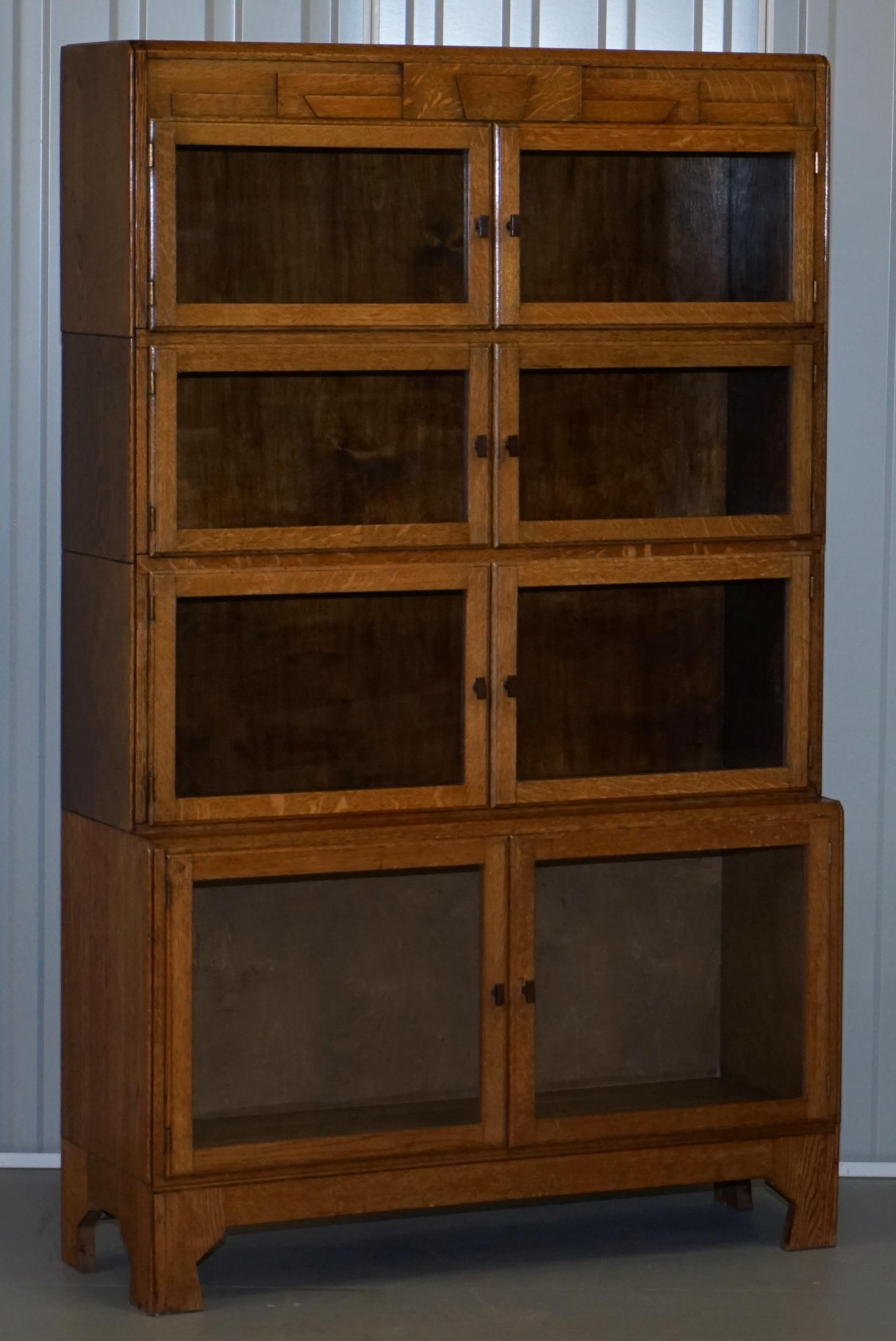 We are delighted to offer for sale this lovely pair of early circa 1920 Minty oxford stacking legal bookcases in solid oak made in the Art Deco style

A very good looking and well-made pair, there were a number of companies making this type of