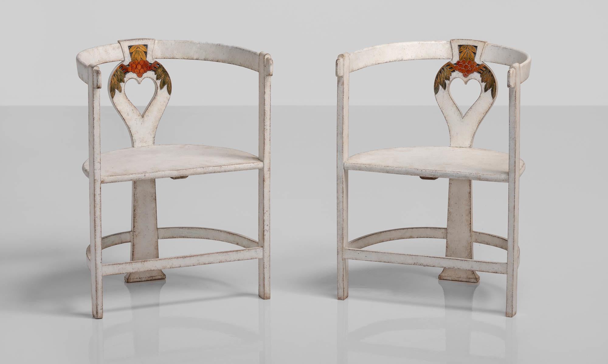 Rare pair of artists chairs, Sweden, circa 1910.

3-leg semi-circular form in original, beautifully patinated paint includes colorful detailing and a heart-shaped element in the back support.

Measures: 22