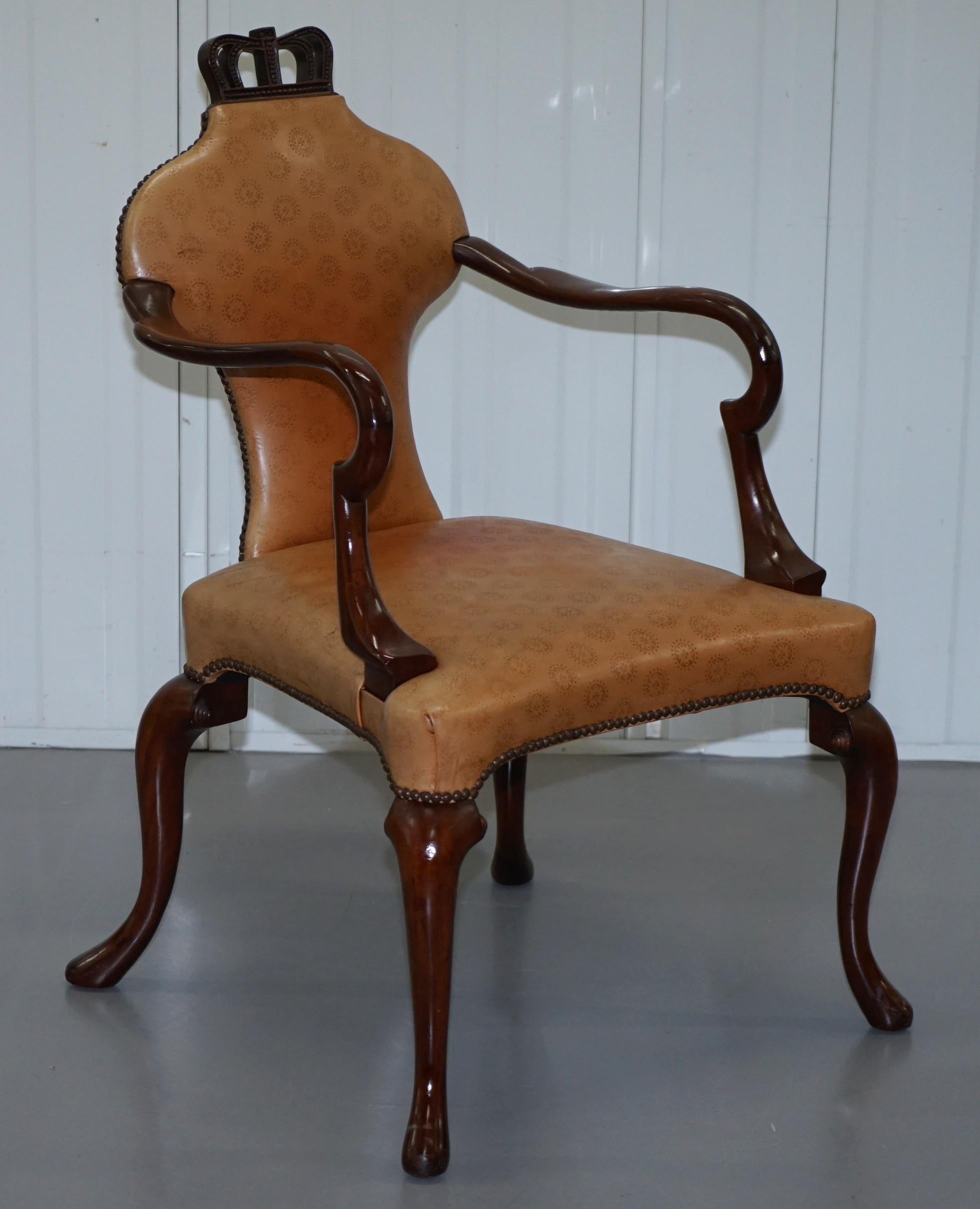 We are delighted to offer for this stunning pair of original Baker Furniture Queen Anne armchairs from the Stately Homes collection with custom embossed leather upholstery

These chairs have been left the natural tan brown colour however they can