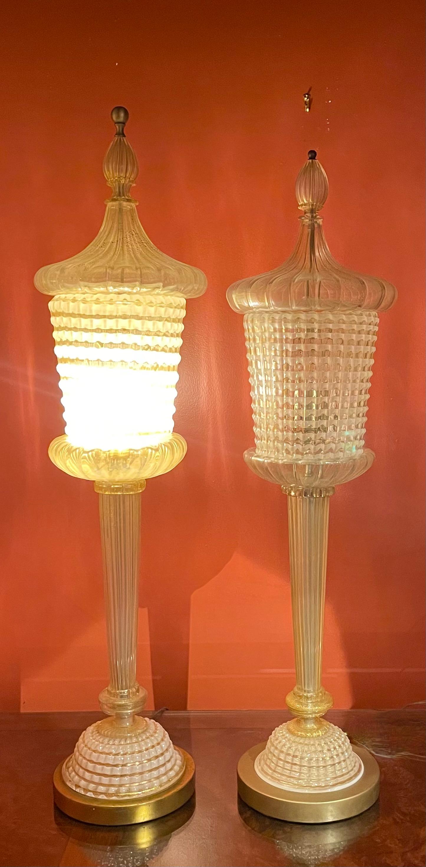 This hugely scaled pair of Barovier and Toso attributed hand blown torchere lamps are extremely hard to find. They differ ever so slightly in scale but to my eye that makes them even more attractive. 

Karl Lagerfeld owned a nearly identical one