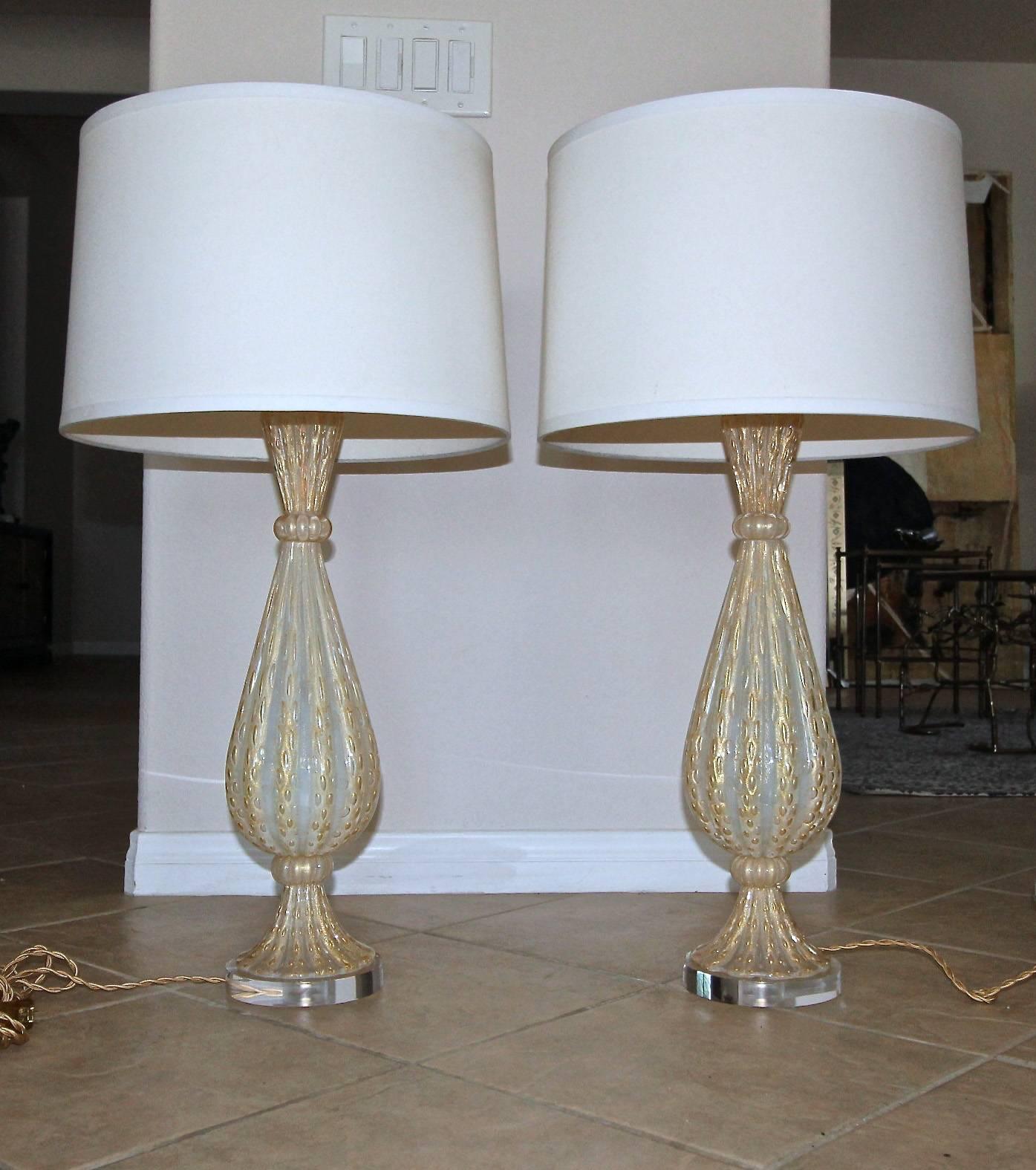 Pair of exquisite Barovier & Toso handblown opalescent Murano glass lamps with gold inclusions and controlled bubbles. Newly wired for US with full range dimmer sockets, brass fittings with custom acrylic bases and French style rayon covered cords.