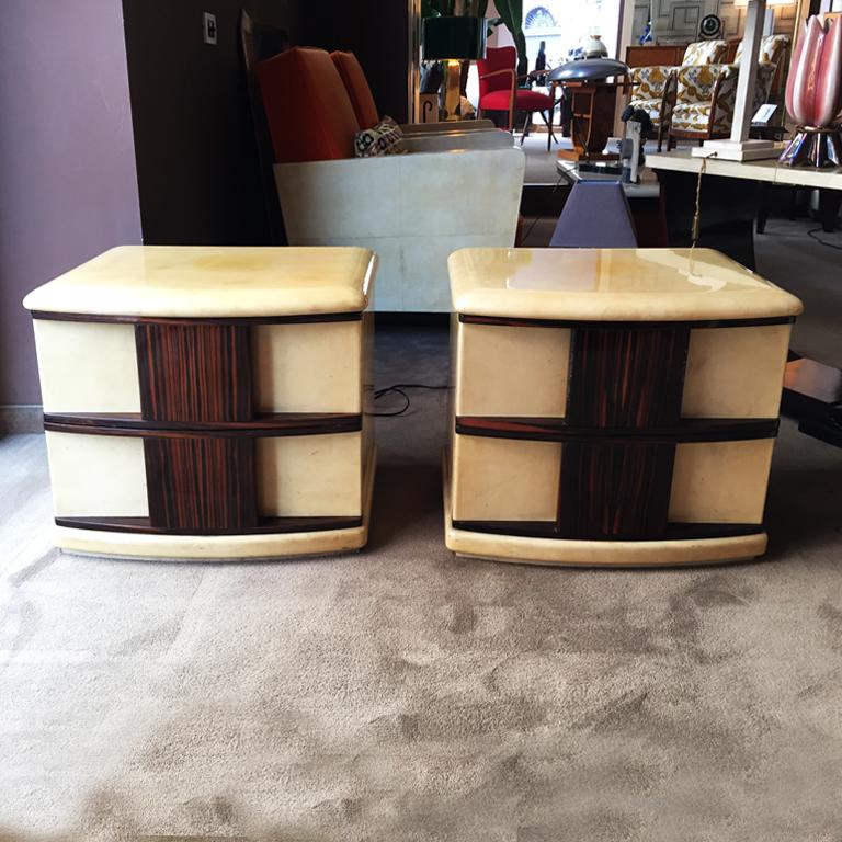Stunning original rare pair of bedside tables designed by Aldo Tura in parchment and wood.