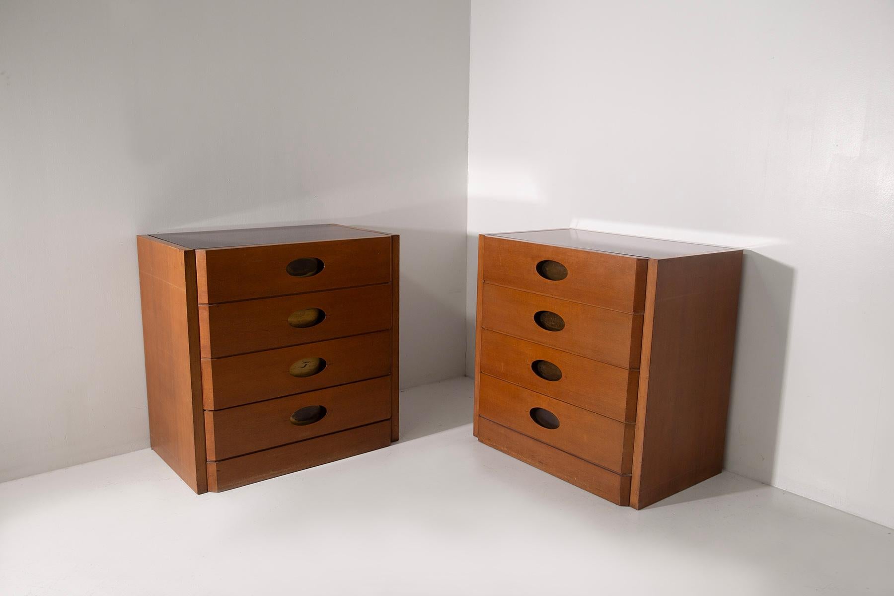 An exceptional and rare pair of LARGE chests of drawers from the 1950s designed by renowned architect Luigi Caccia Dominioni, a pivotal figure in Italian modernist design. These chests of drawers, made of high-quality walnut wood, are a testament to