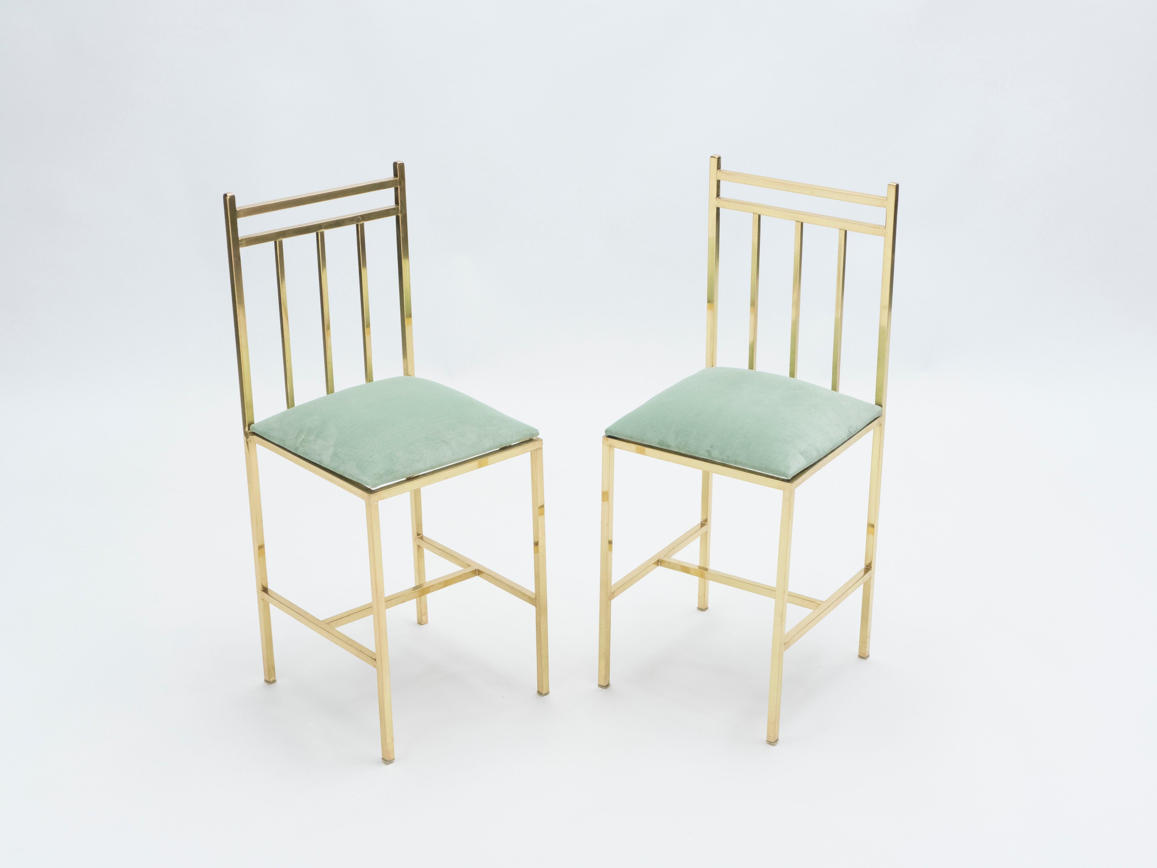 Rare and cool kid’s brass chairs attributed to Marc Du Plantier and made in the early 1960s. Beautiful geometric brass design towers to newly upholstered water green velvet seats by Nobilis, reference Calder. The bright brass and rich fabric