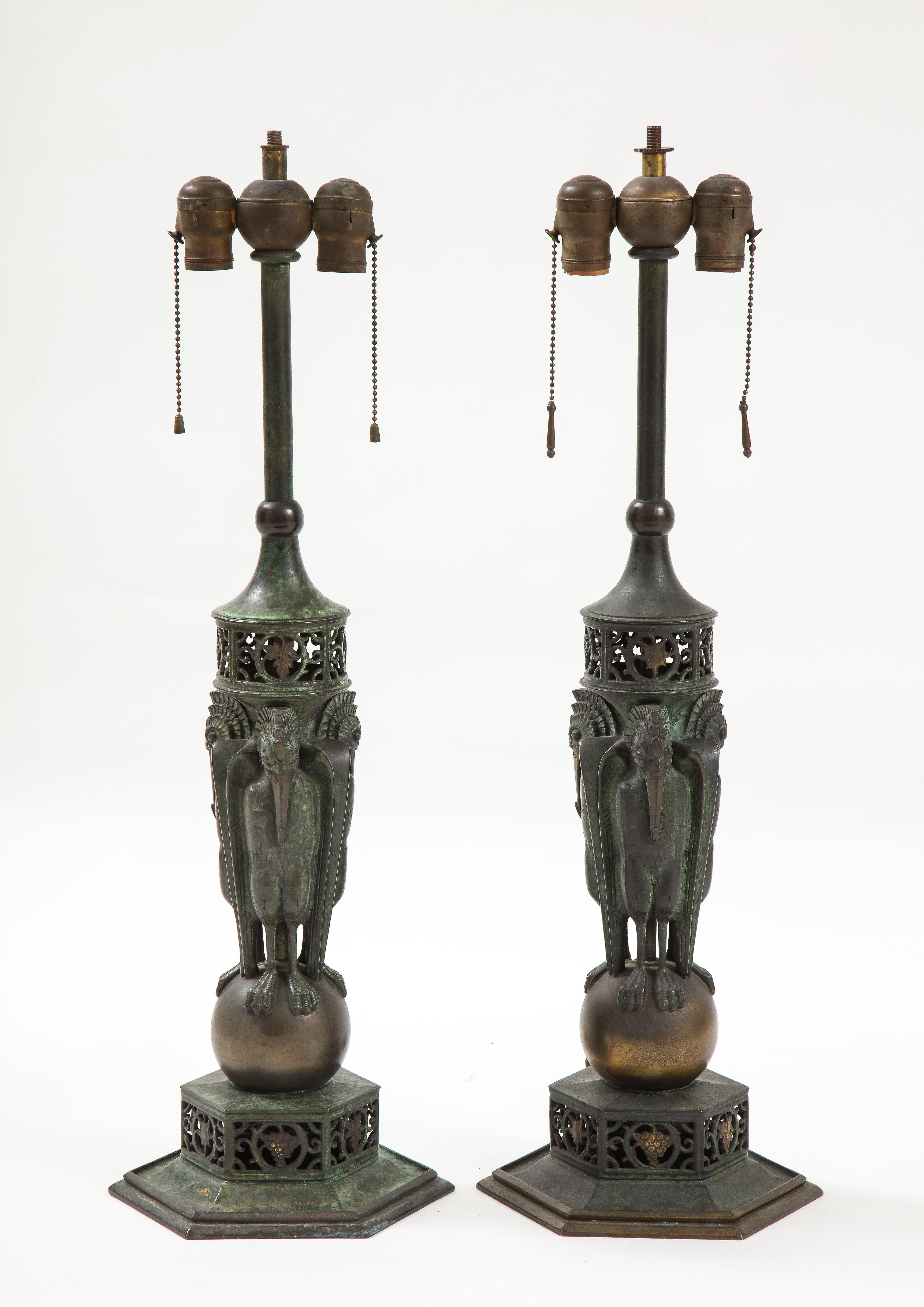 Pair of Art Deco period bronze patinated Oscar Bach table lamps, each supported by three patinated bronze storks. Oscar Bruno Bach (Breslau, Germany, 1884 - New York, NY, 1957)
German born craftsman Oscar Bruno Bach was one of the most technically