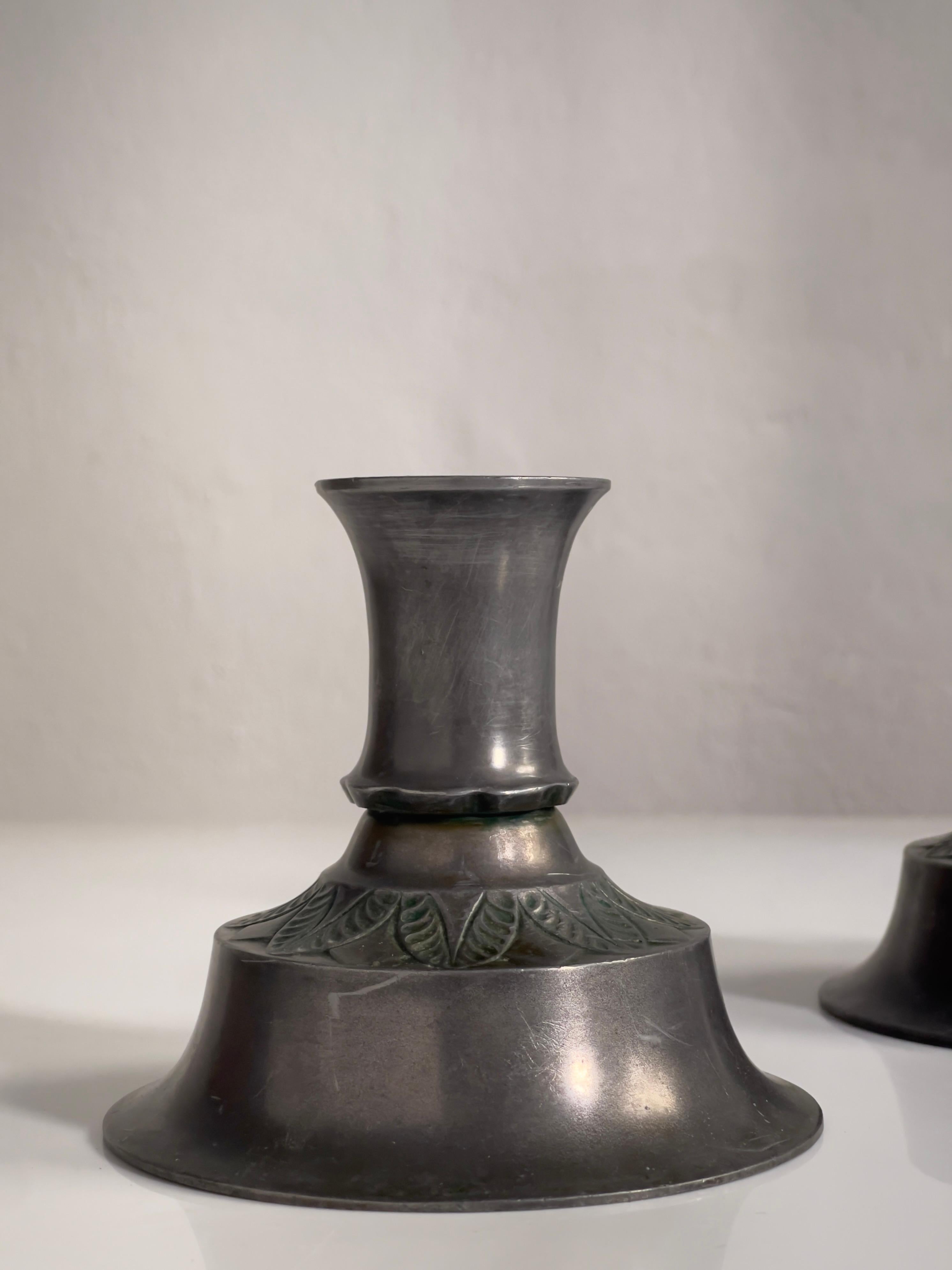 Patinated Rare pair of candlesticks by Danish sculpture and silversmith Just Andersen 1920 For Sale