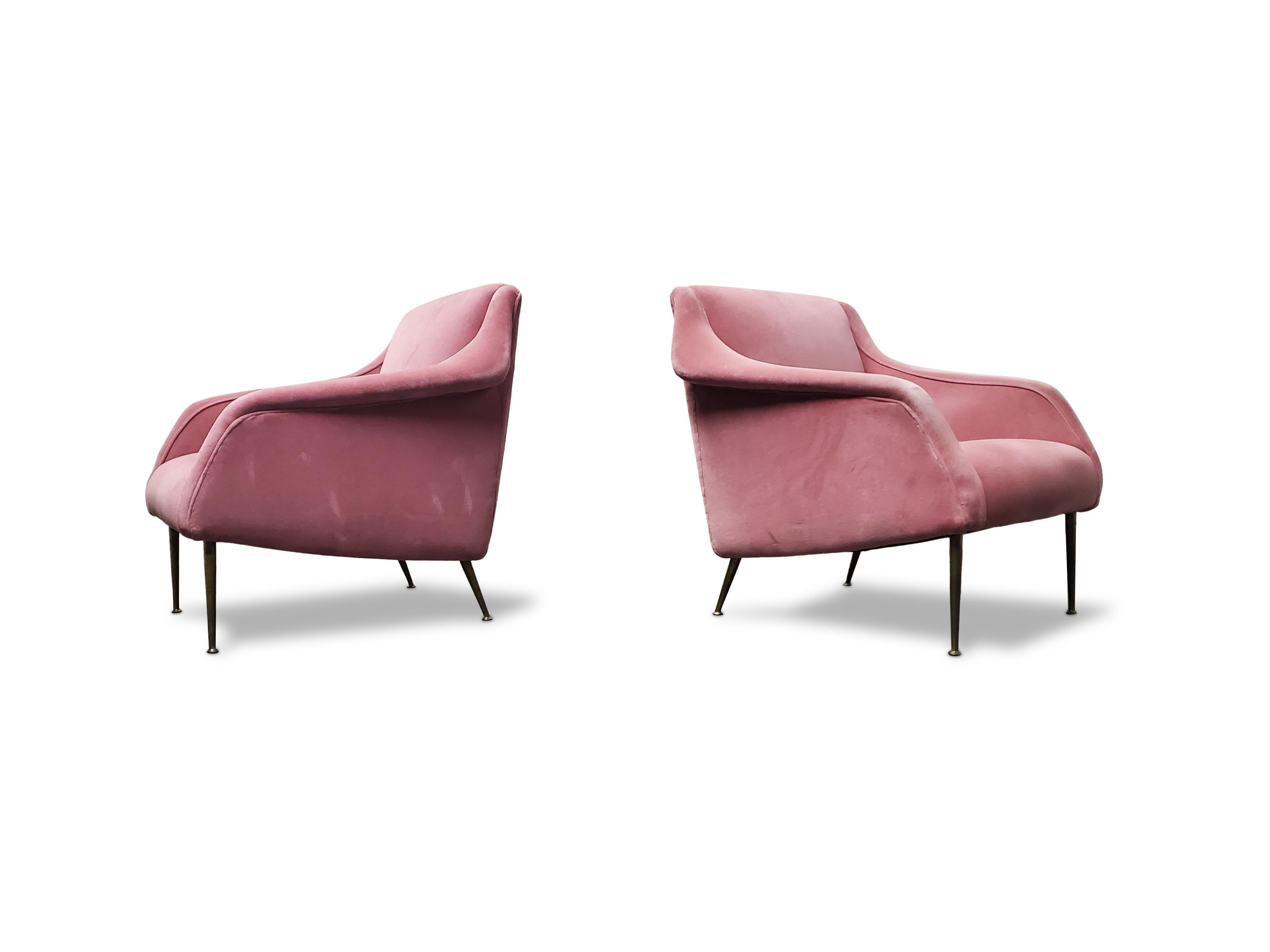 Rare pair of Carlo de Carli lounge chairs.

