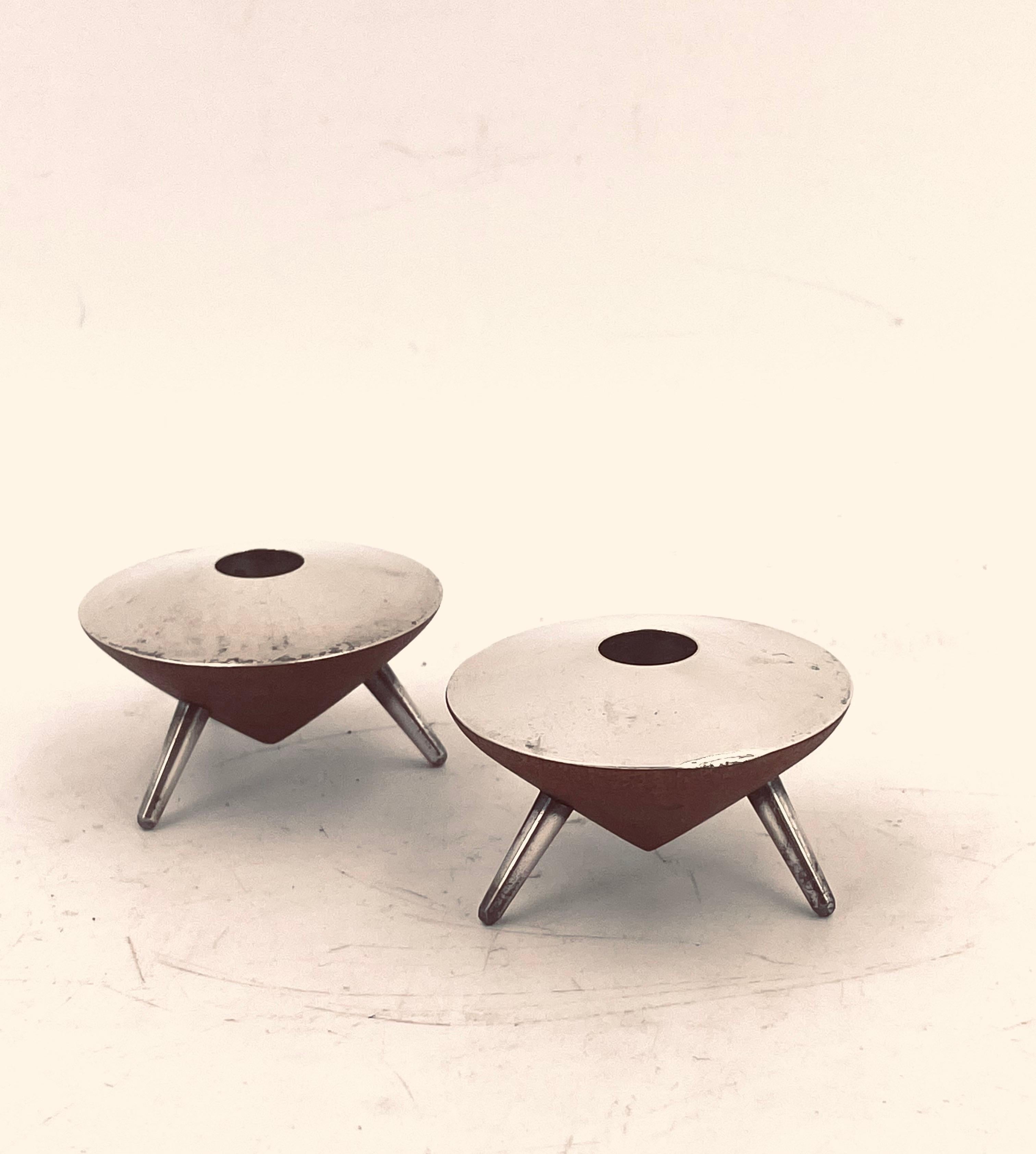 A very rare pair of Danish modern Atomic age, candle holders we never seen or had these set in a stock, solid teak vase with silver legs and tops you can fit tapered long candles, we have polished a little the silver one shows small ding on the side