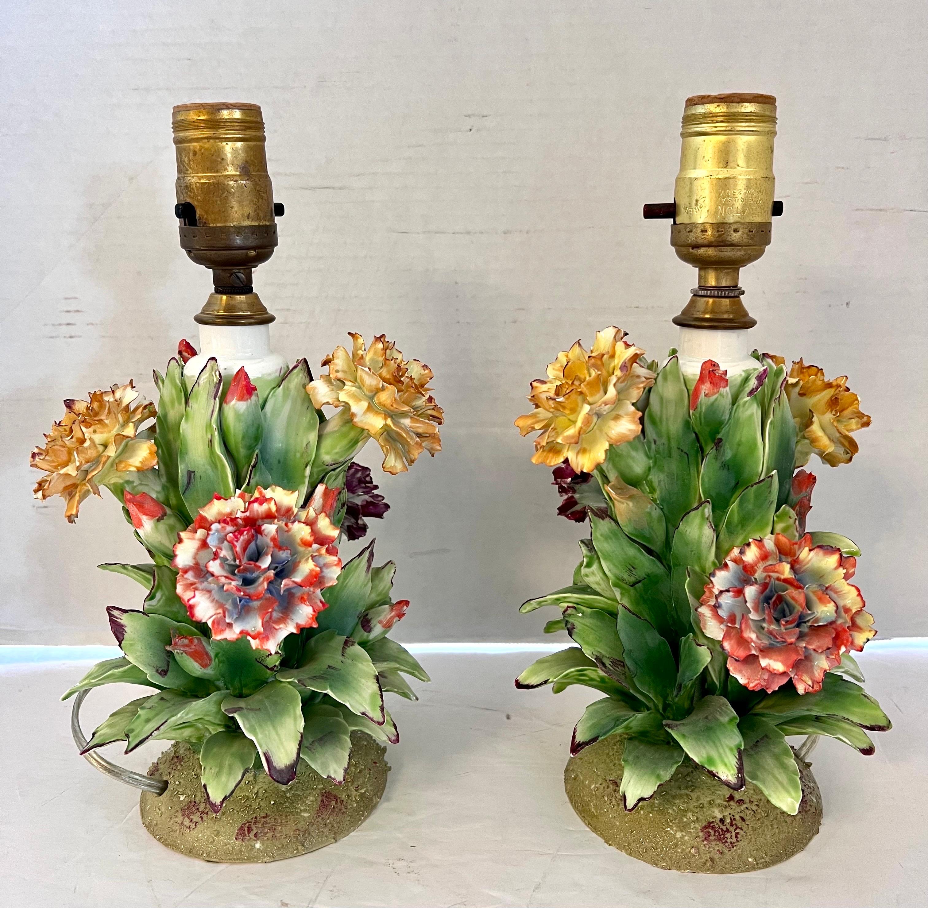 This pair of Capodimonte lamps look like works of art! They feature meticulously hand crafted porcelain flowers throughout and are quite diminutive - see dimensions above. Perfect for a bedroom! Wired and in perfect order.