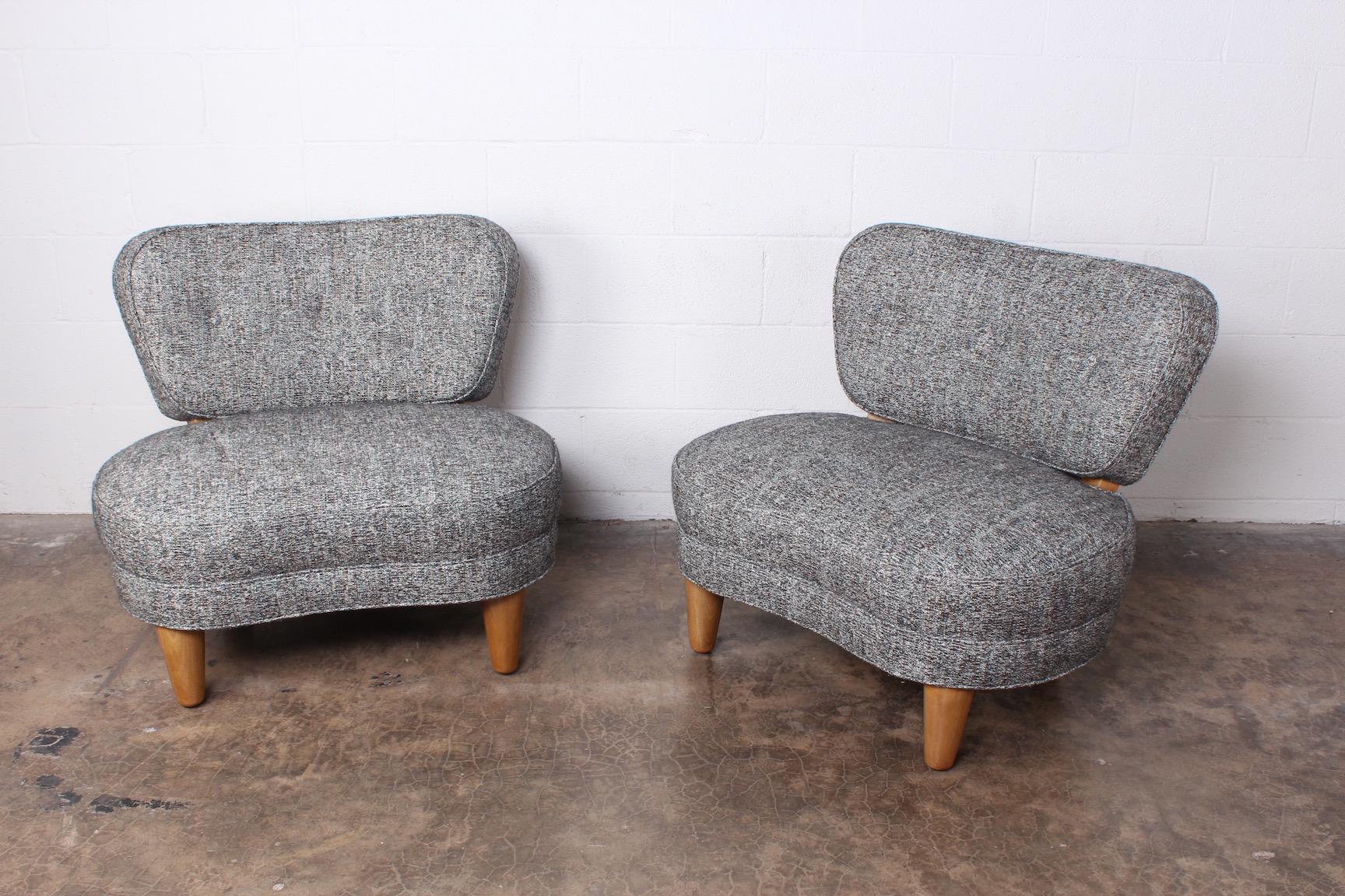 A rare pair of slipper chairs with bleached mahogany frames. Designed by Edward Wormley for Dunbar.