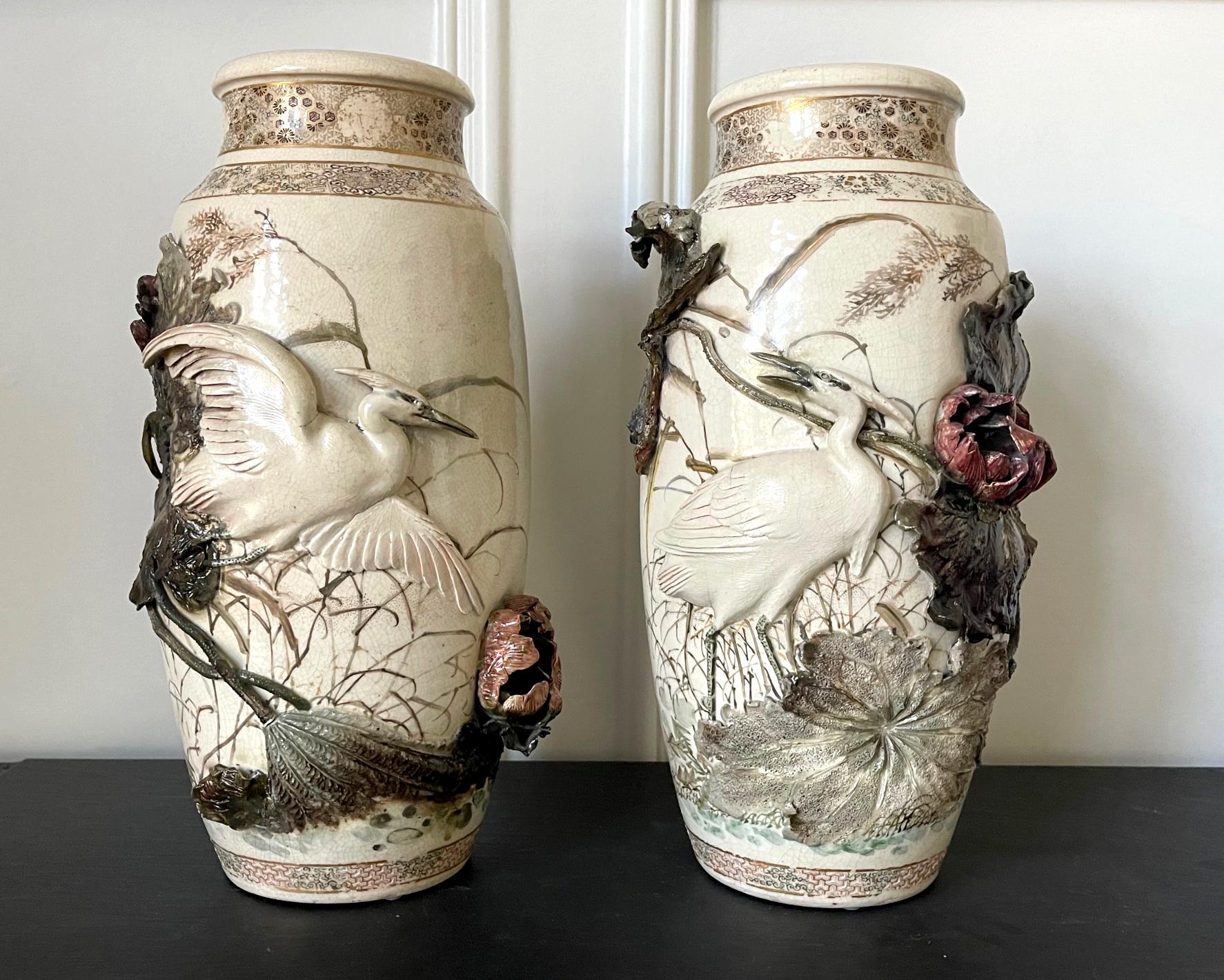 A stunning pair of ceramic vases with gilt, paint and high-relief decoration by imperial artist Makuzu Kozan (1842-1916, also known as Miyagawa Kozan) circa 1876-81 (late Meiji period). These vases belong to early period (1876-1881) of Kozan's