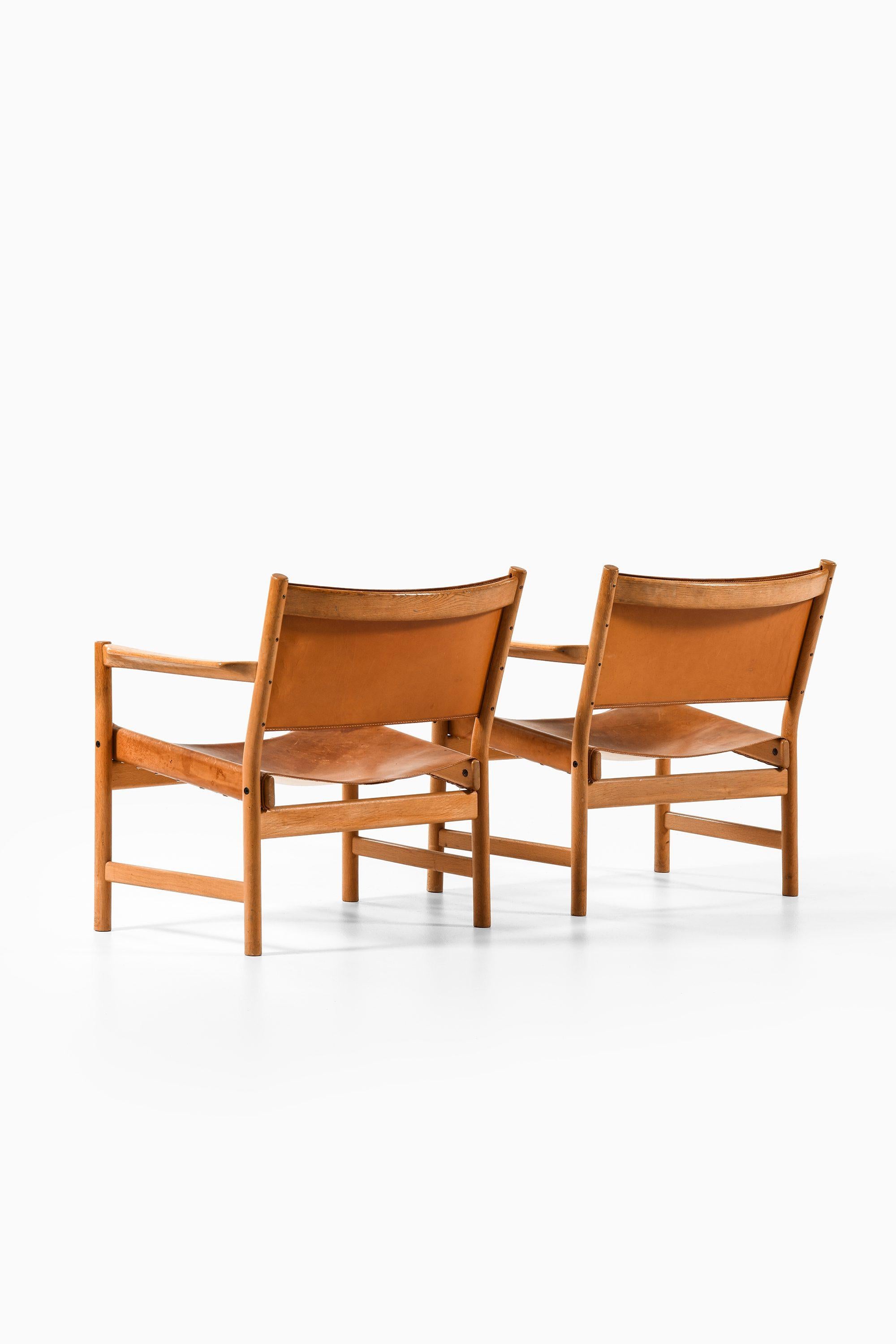 Scandinavian Modern Rare Pair of Easy Chairs in Oak and Leather by Alf Svensson, 1960's For Sale