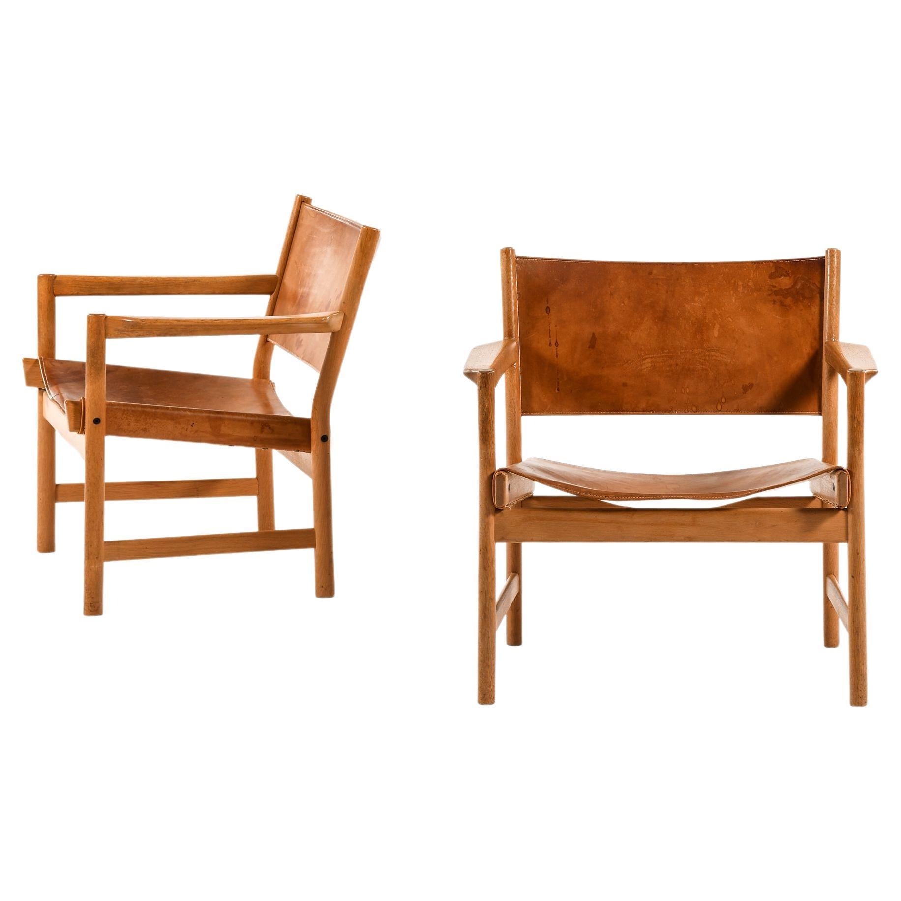 Paire de fauteuils rares en chêne et cuir d'Alf Svensson, années 1960