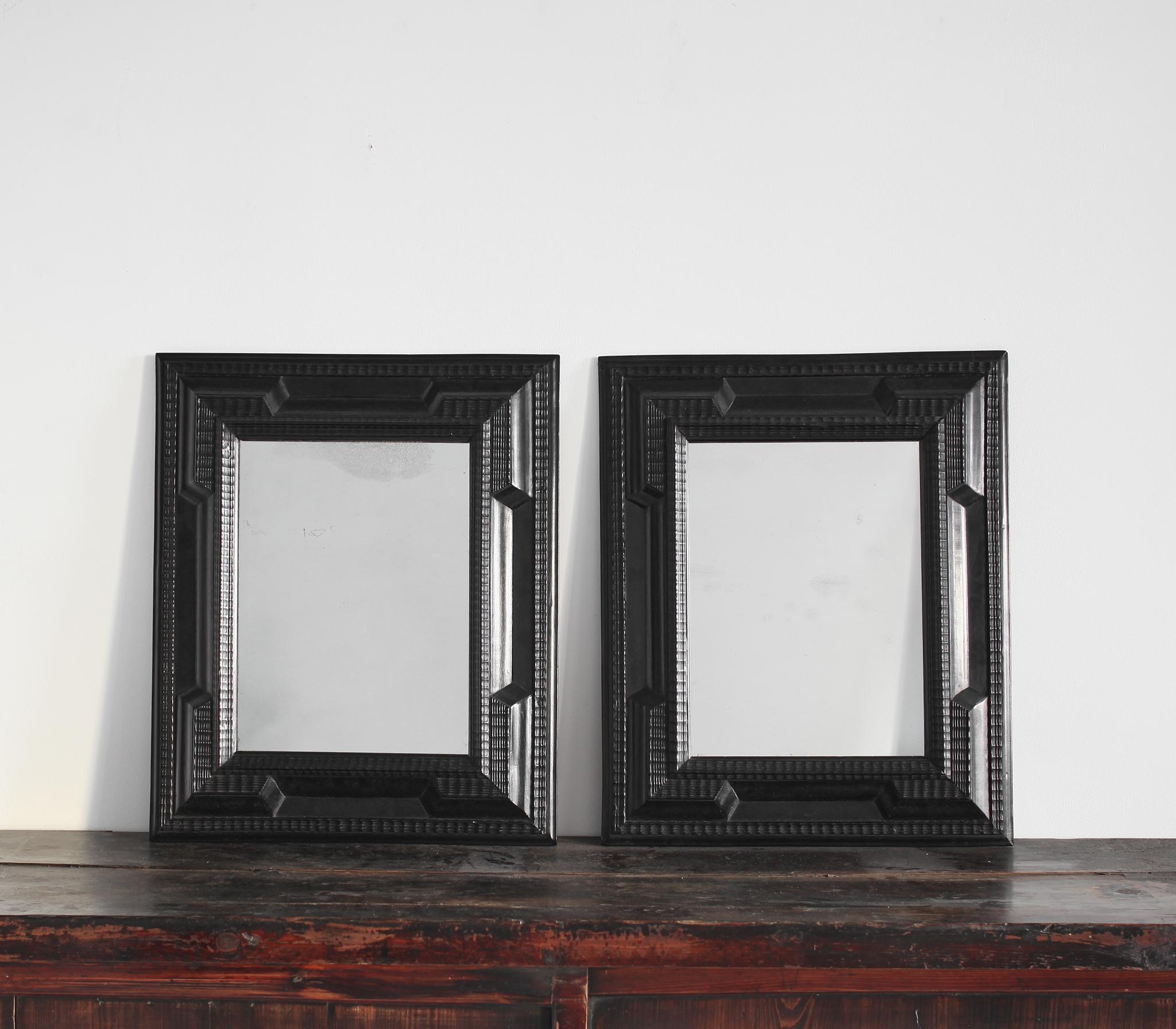 A rare pair of 19th C. Ebonised Italian ripple mirrors with nicely foxed & sparkly mercury mirror plate.

Exceptionally well made & in great condition for their age.