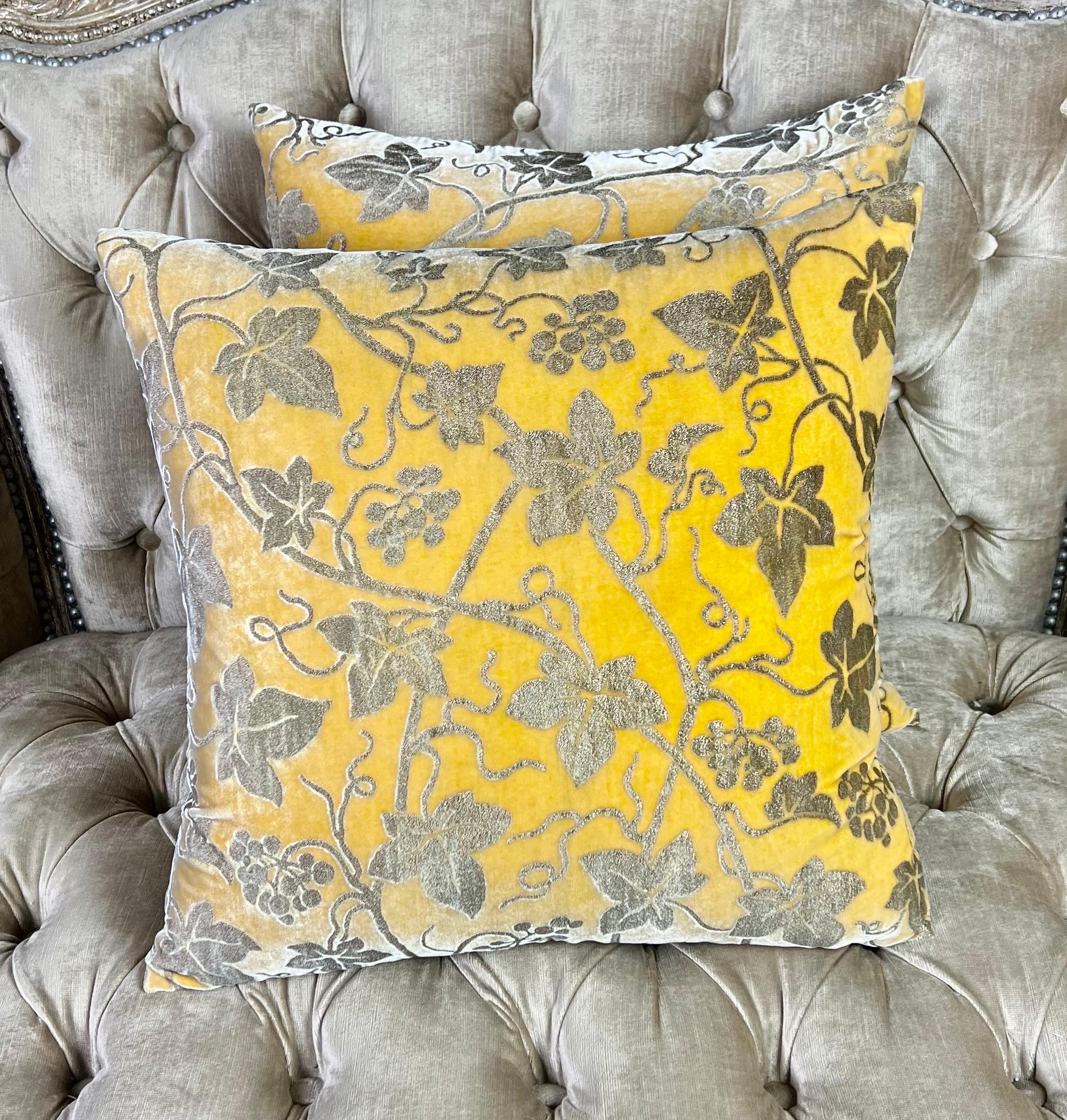 Pair of custom pillows made with rare printed silk velvet by Mariano Fortuny in the Edera pattern depicting twirling vines and grapes.  The yellow is beautiful and vibrant and would add a great accent of color in your room.  The pillows have