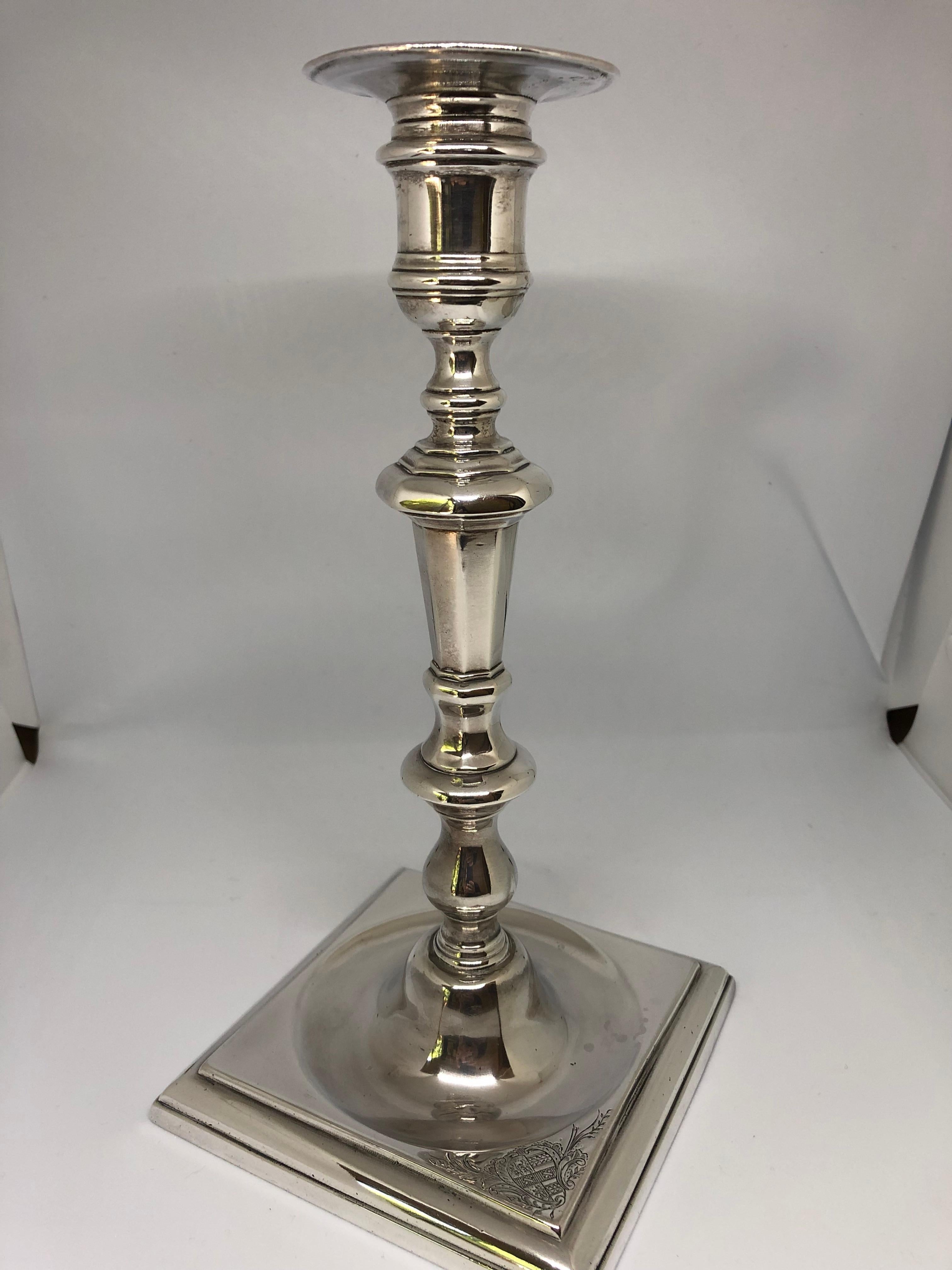 Irish Silver.

A very rare pair of eighteenth-century Irish silver cast candlesticks, each of knop baluster form, with square stepped base and circular sunken centres.
Dublin, c.1760.
Height 27cm. Width of base 13cm.
Combined Weight 1,326.8 grams /