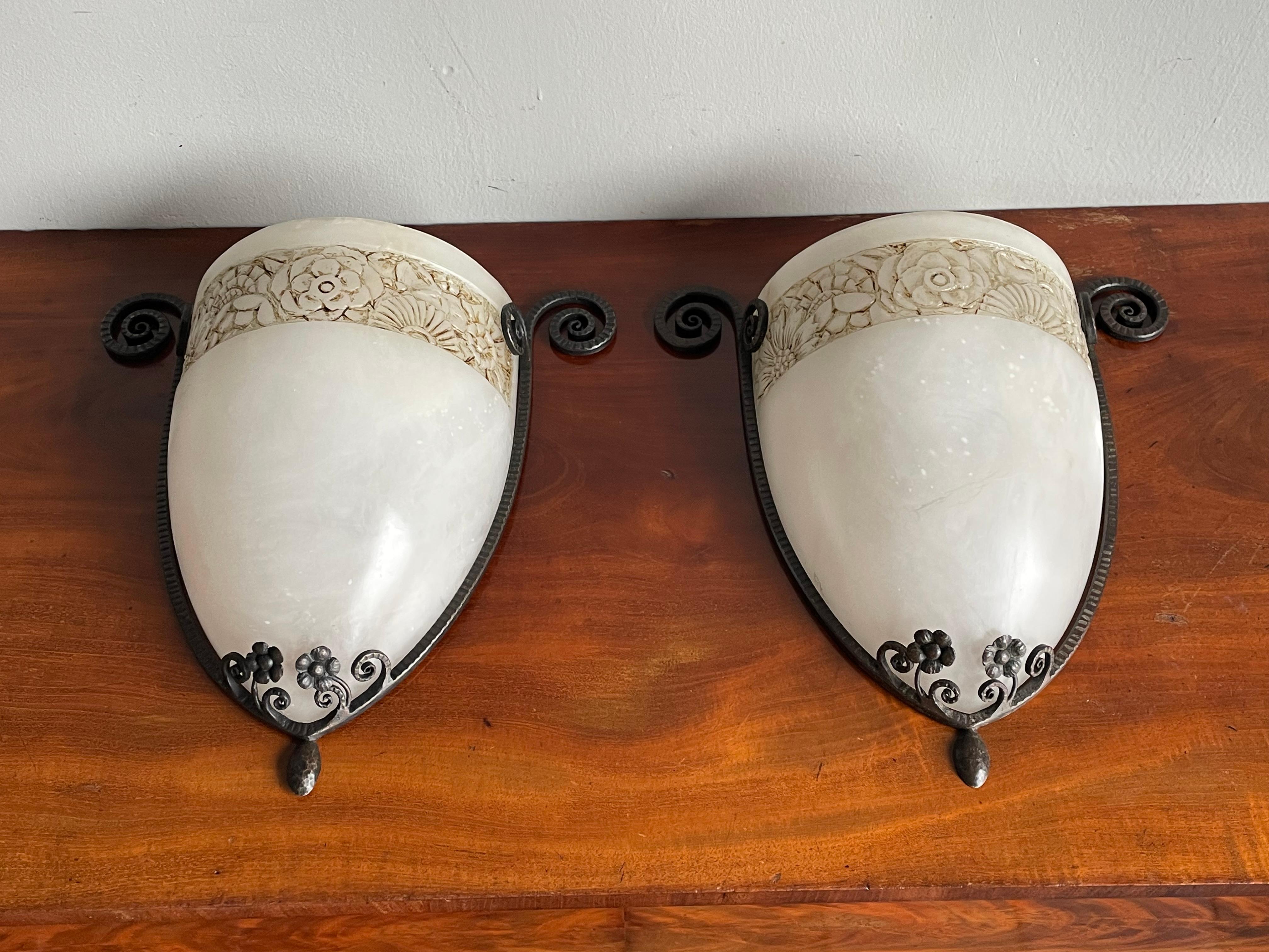 Real and very rare pair of Art Deco alabaster sconces.

Over the years we have seen and sold our fair share of top quality made, antique alabaster pendant lights and chandeliers. And when we found these Art Deco wall sconces, we again realized how