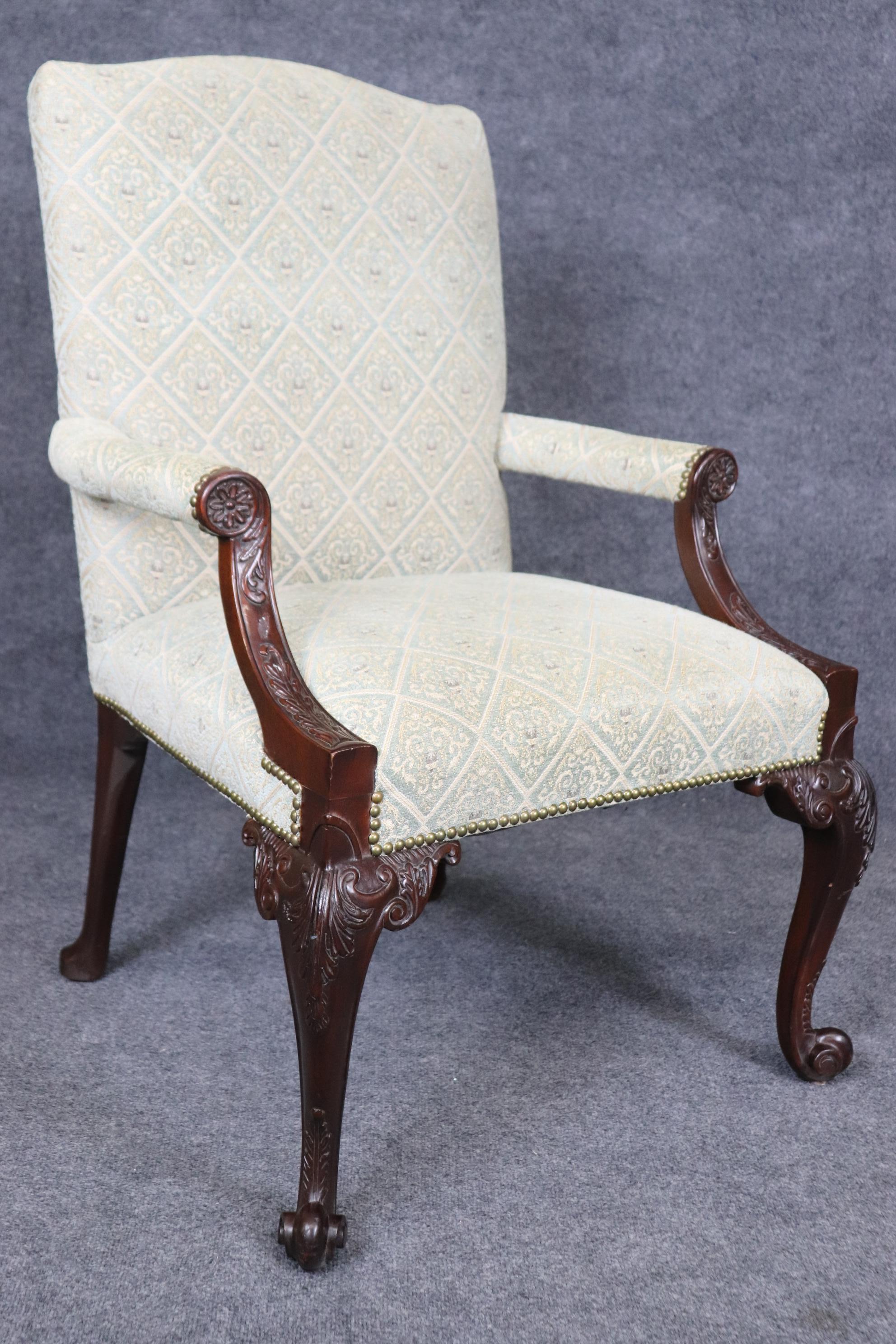 This is a gorgeous and large scale pair of armchairs. The chairs are beautifully carved mahogany with age-appropriate signs of wear and use on the finish and may show signs of use on upholstery as the upholstery is older. Measures 40 tall x 27 wide