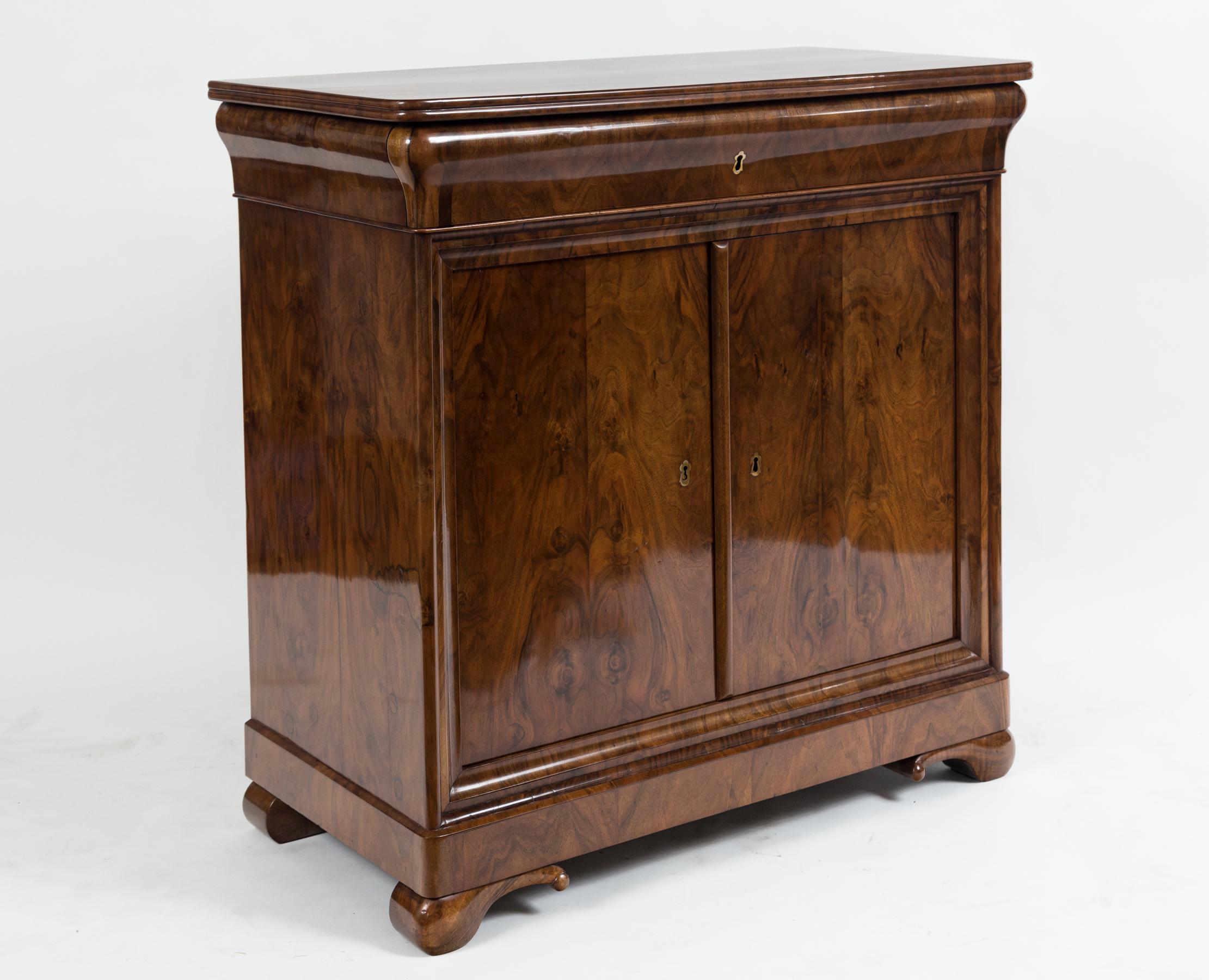 Pair of Sleek French Louis Philippe cabinets in walnut veneer comprised of wooden tops (not marble) a drawer with two doors, note concave drawer fronts
Origin: France
Date: 1830ca
Condition: Excellent, re-polished
Dimensions: 36” high, 36” wide,
