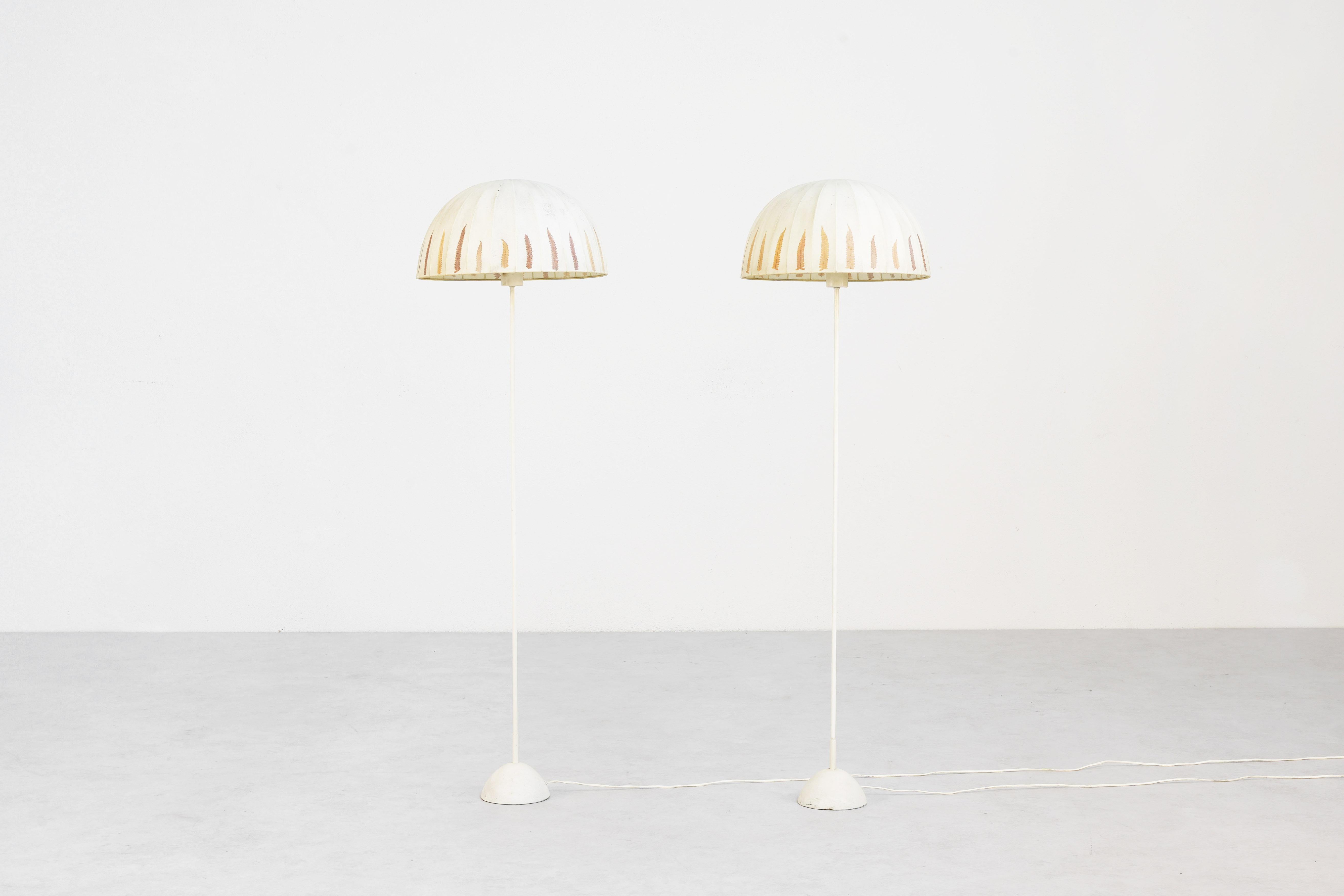 A beautiful pair of rare floor lamps designed by Hans-Agne Jakobsson in the 1960s and manufactured by Markaryd in Sweden. Both lamps are in good condition with minor signs of use and age, and everything remains in its original condition. The shades