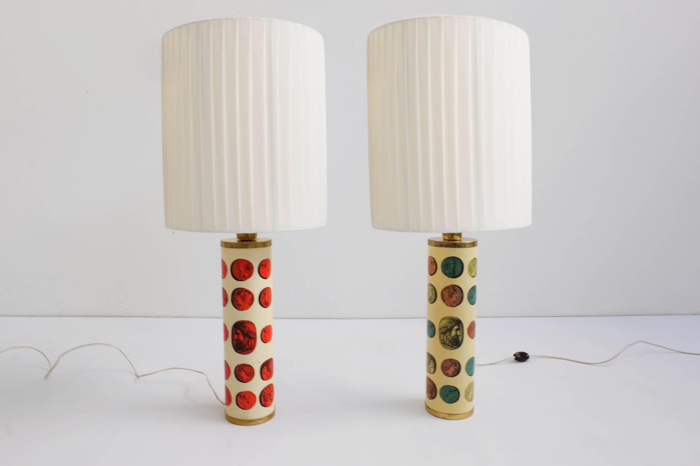 Rare pair of Fornasetti table lamps mod. Cammei, Italy, 1968. Literature: Fornasetti, by Barnaba Fornasetti. Text by Mariuccia Casadio, 2009 Electa
Lamp shades are new.