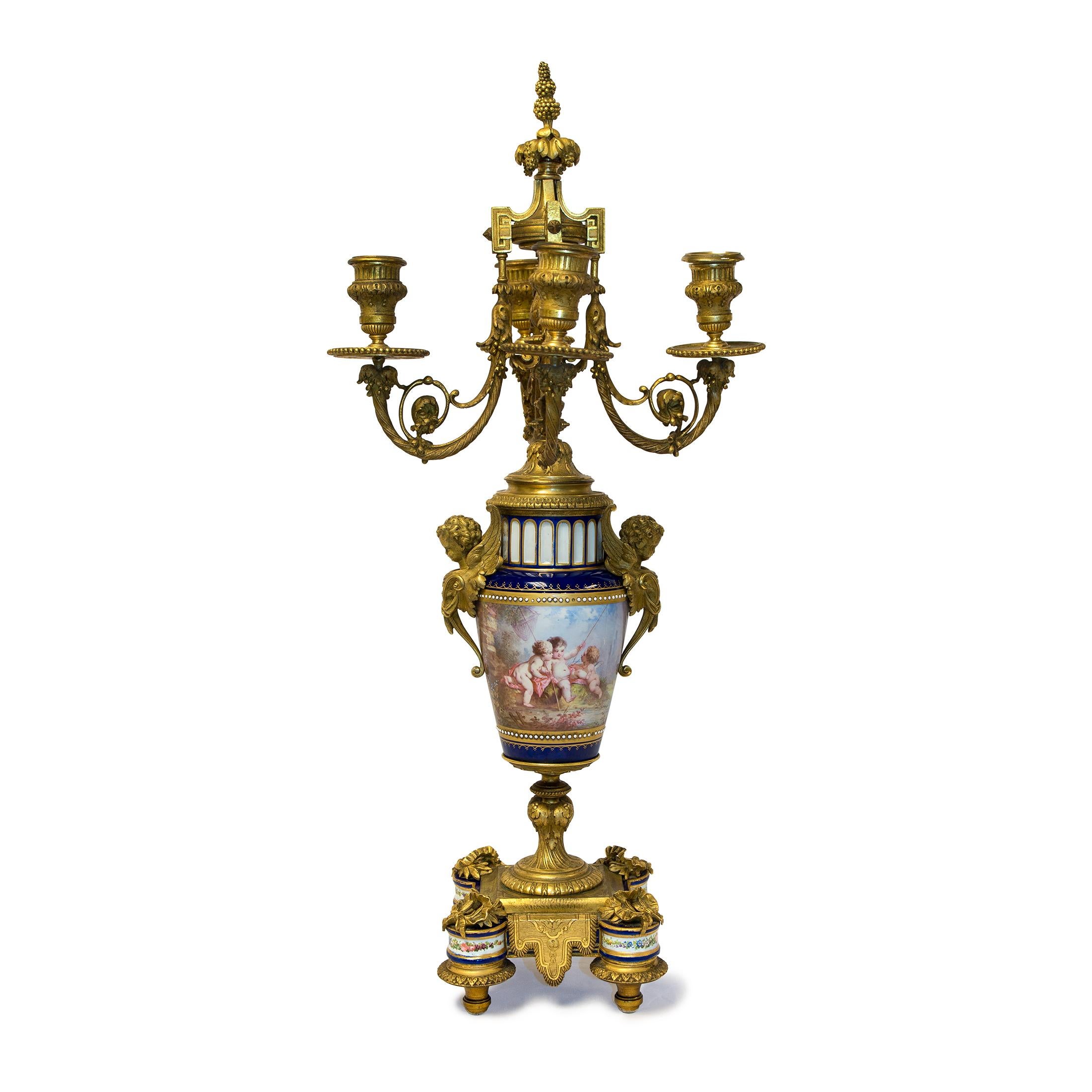 Rare pair of four-branch gilt bronze and jeweled cobalt blue ground Sèvres style porcelain candelabras
Date: 19th Century
Origin: French
Dimension: 23 in x 10 1/2 in.