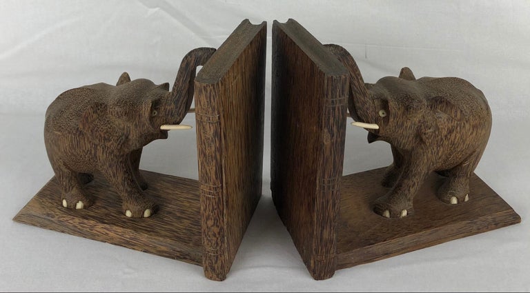 A wonderful quality pair of French hand-carved wooden bookends. Made with rare palm wood.

These handcrafted bookends will look wonderful to display your favorite books on a nightstand, mantel, dresser or shelf. The all natural palm wood which was