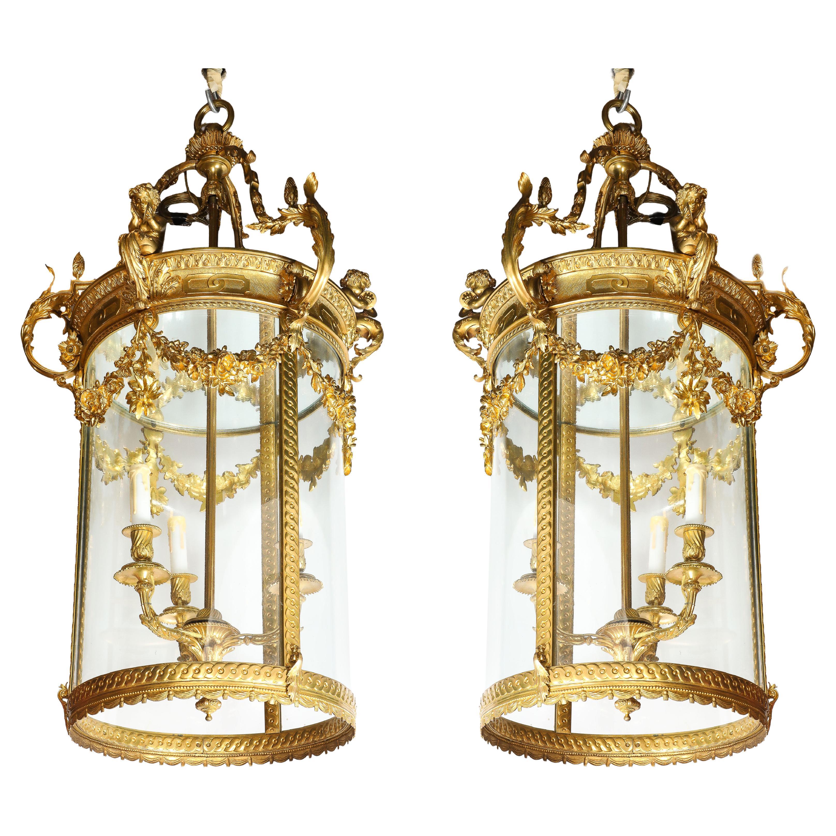 Rare Pair of French Luis XVI Bronze Lanterns with Cupids and Garlands of Flowers For Sale