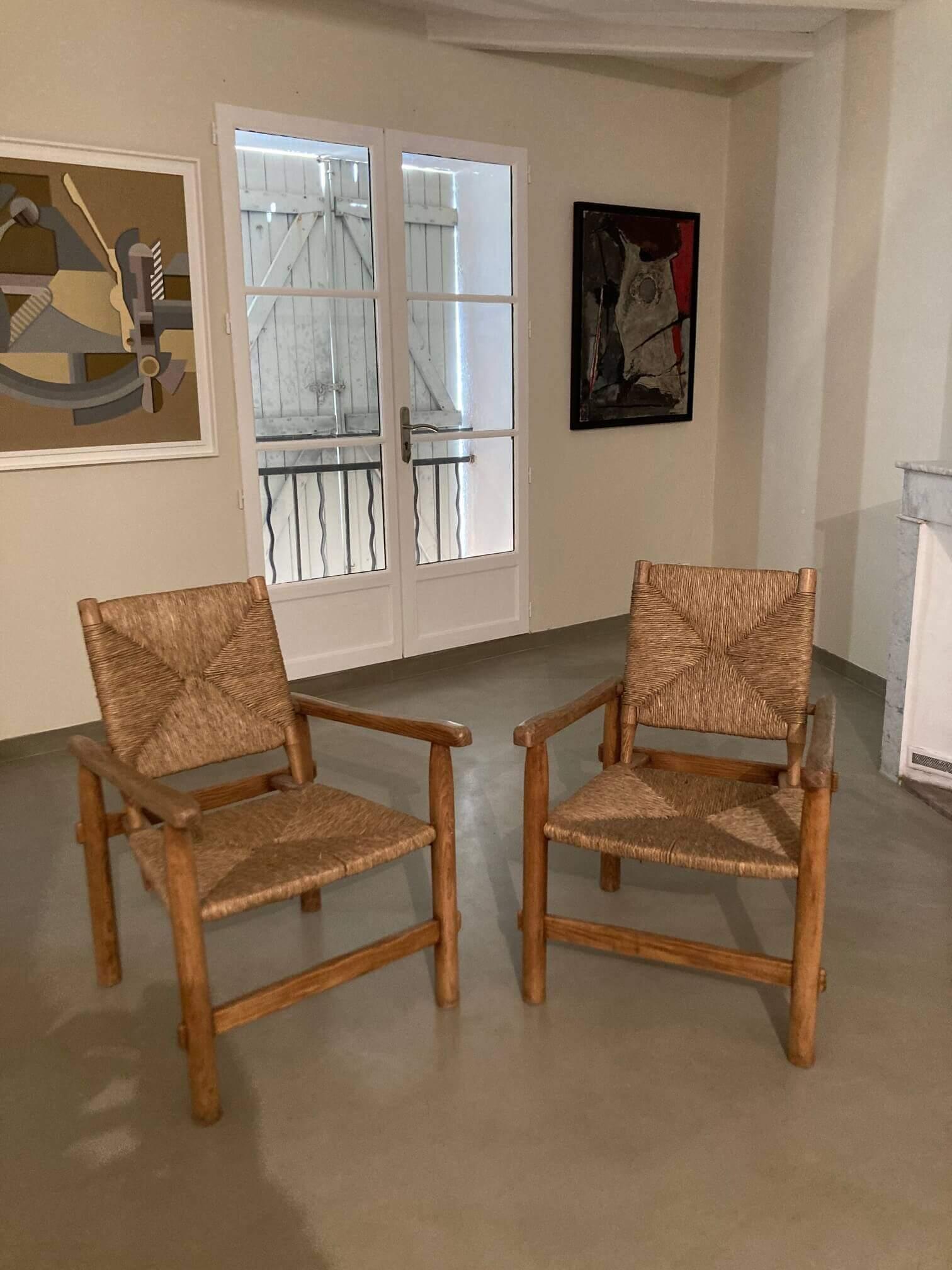 Paille Paire de fauteuils authentiques authentiques, originaux, par Charlotte Perriand, vers 1945