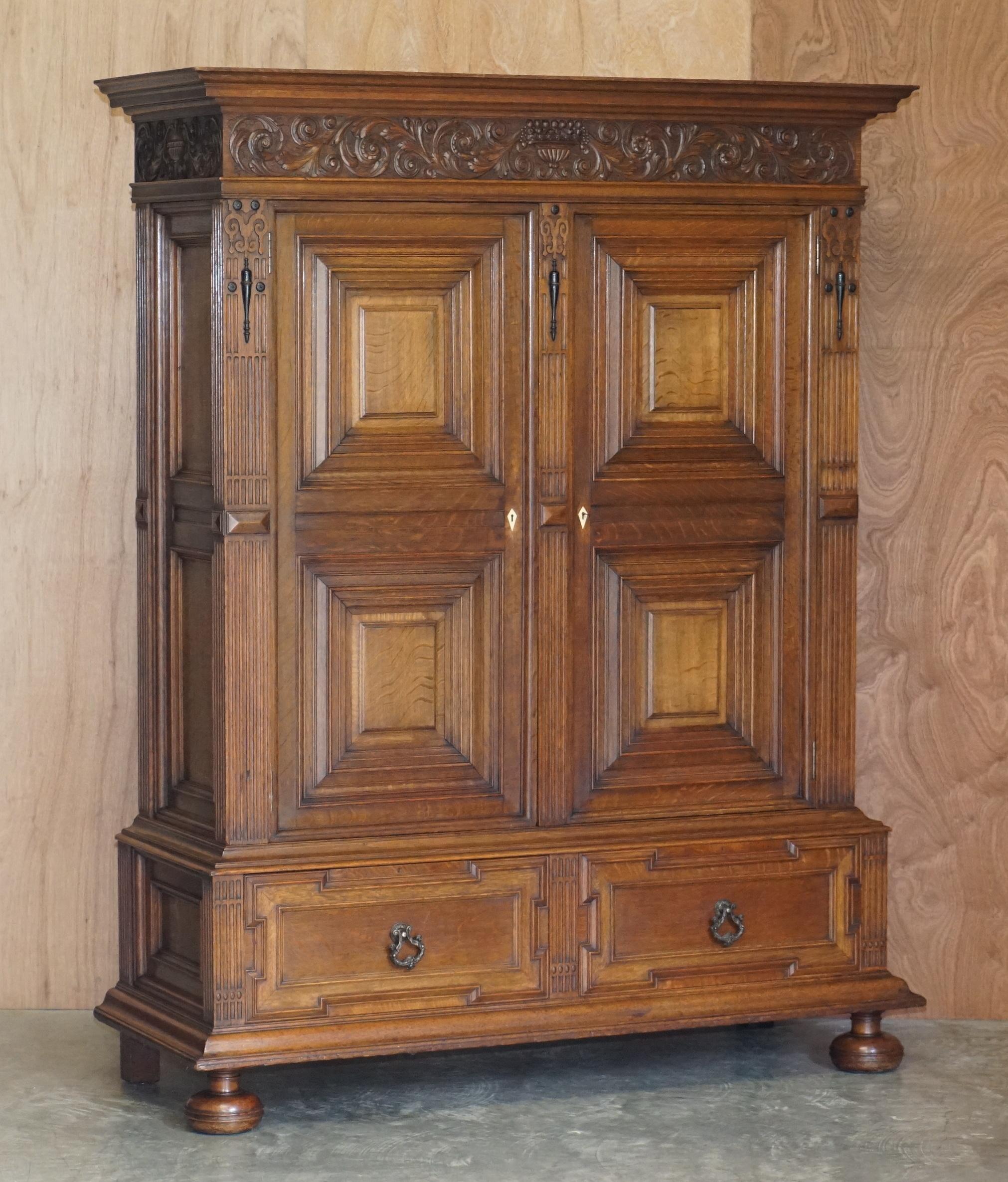We are delighted to offer for sale this stunning near pair of original Victorian heavily hand carved oak library bookcase cabinets made by the world famous firm of Gillows of Lancaster & London

If you are in the market for the finest pair of