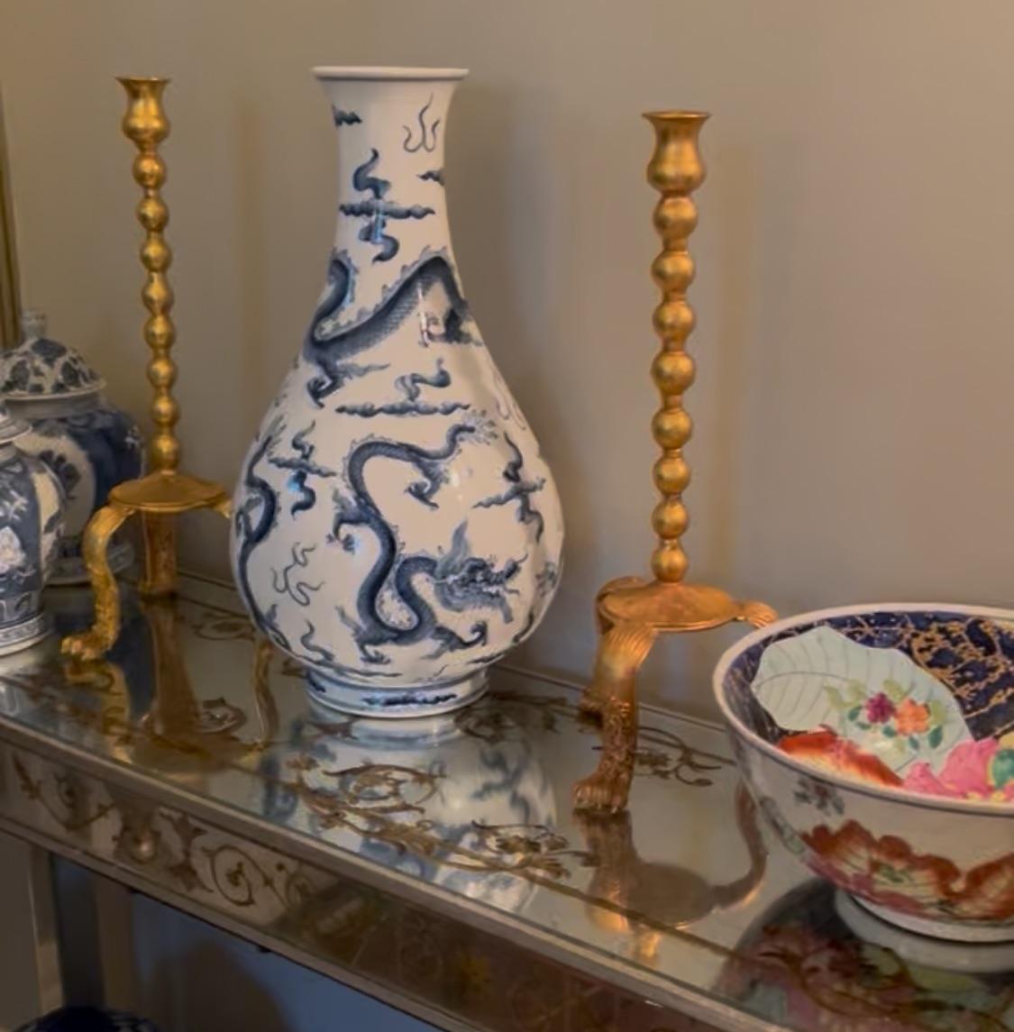 A Rare Pair of Tall Gilt Metal Tripod Candlesticks by Lazaro Diaz, Signed 1992, United States

A dramatic and sculptural pair of gilt metal candlesticks by New York designer Lazaro Diaz, signed and dated 1992. Each piece features a tall beaded stem