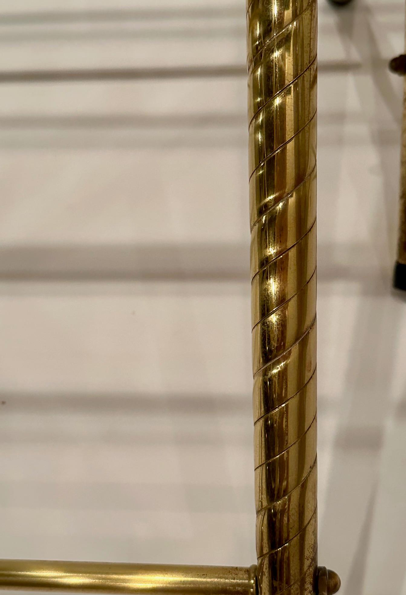 Rare pair of functional glamorous brass luggage racks that fold.  Could add glass tops for stunning end tables.