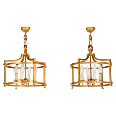 Seltenes Paar blattvergoldeter schmiedeeiserner Kronleuchter von Henri Pouenat