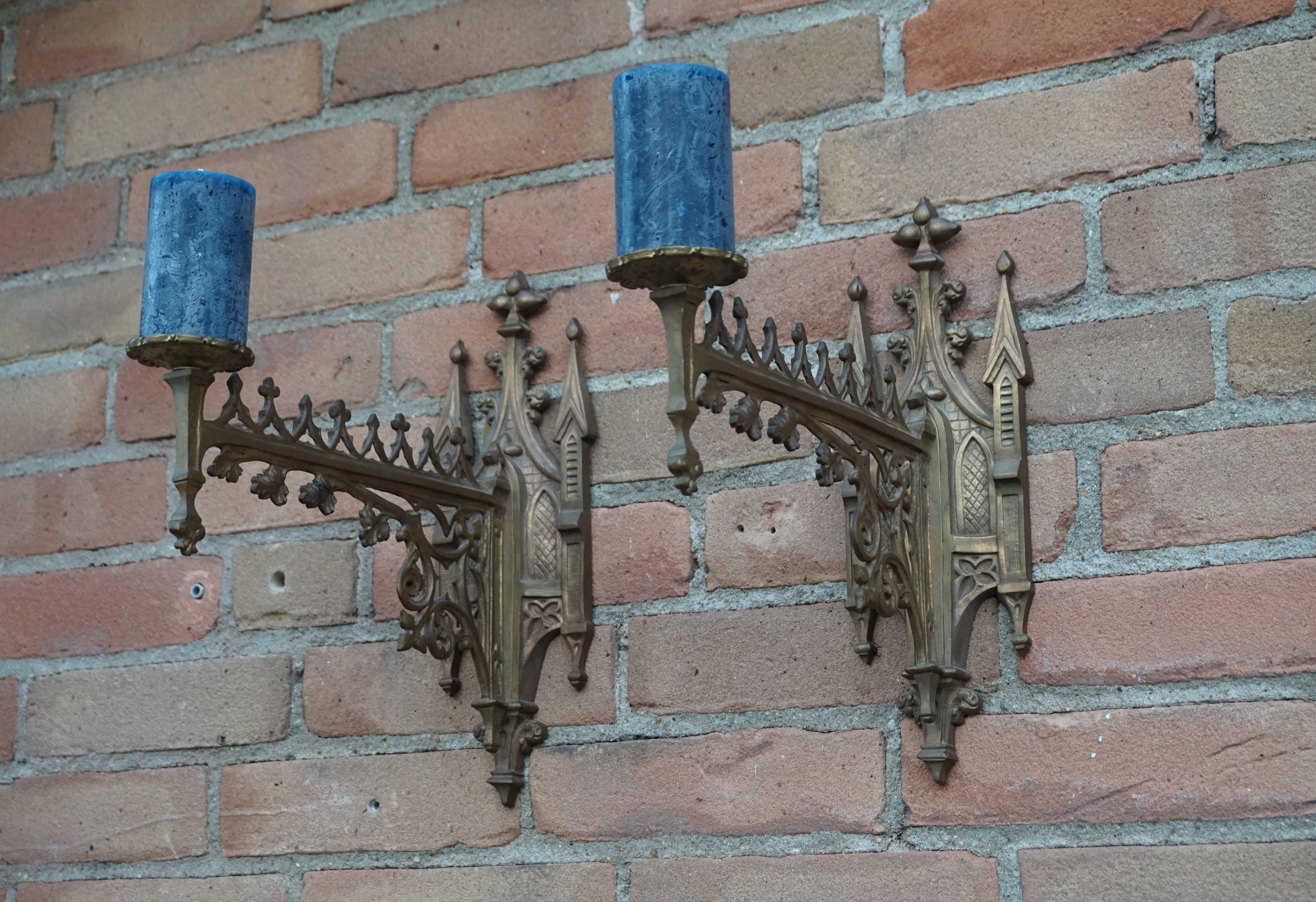 Antique pair of gilt bronze, Gothic Revival candle sconces.

For the collectors of Gothic Revival antiques we offer this rare pair of stylish and highly decorative bronze sconces. Handcrafted, circa 1900 these would have initially been golden