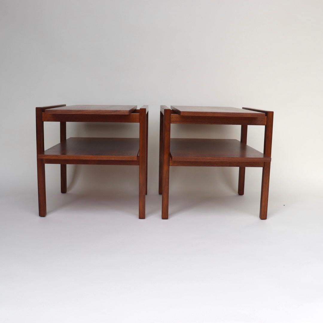 These architectural walnut side tables were designed by Greta Grossman 
Through the 1940's and 50's Grossman exhibited her designs at museums worldwide, including MOMA in New York and the national museum in Stockholm. Yet inexplicably, following